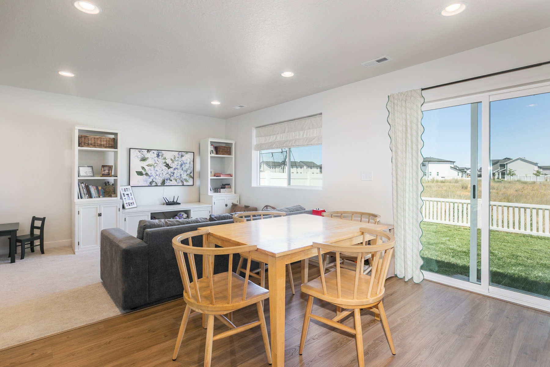 Open-concept living space and recessed ceiling lights. Upgraded carpet, pad and lighting.