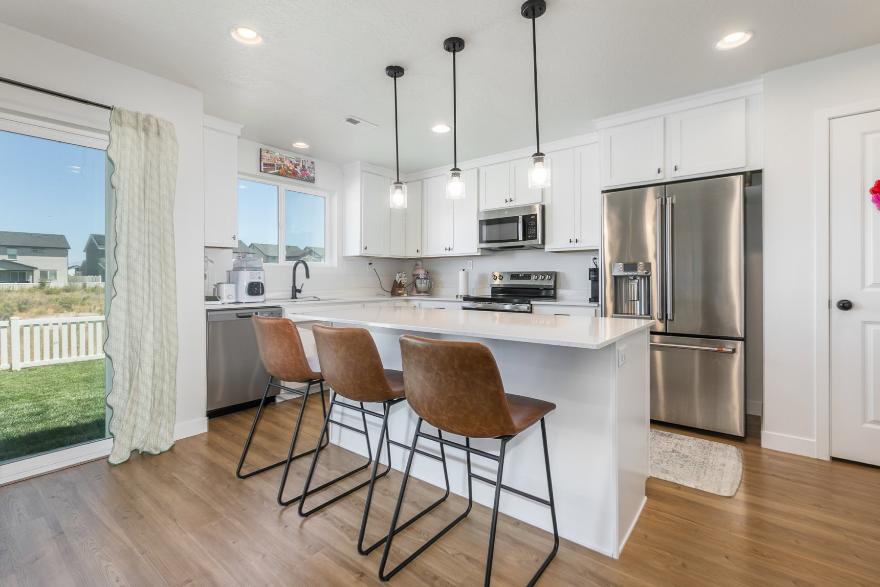 Kitchen upgrades include: 42" cabinets, lighting, VoiceIQ faucet, quartz counter tops, gas line for stove. Refrigerator included.