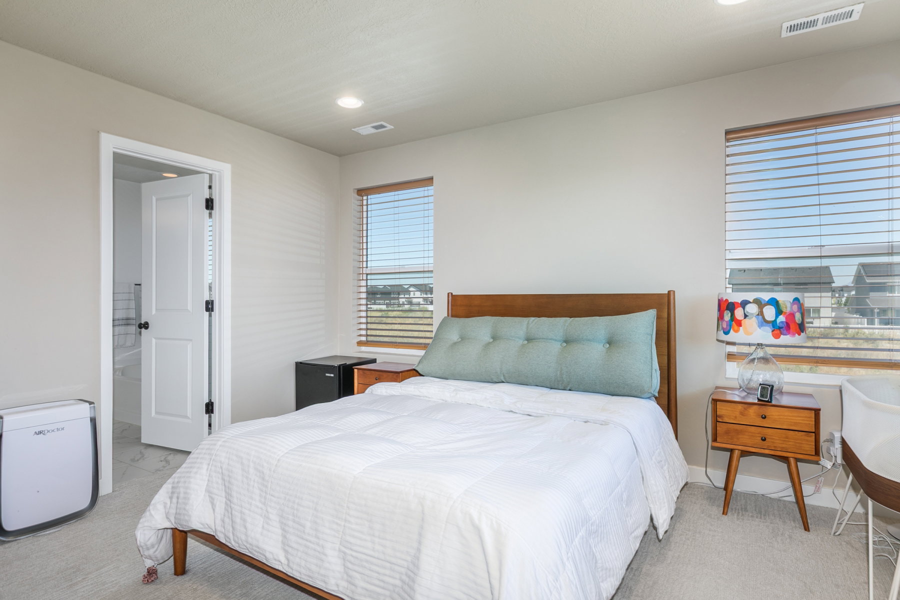 Primary bedroom. Upgrades include extra window, fan mounts prep and closet with built in shelving.