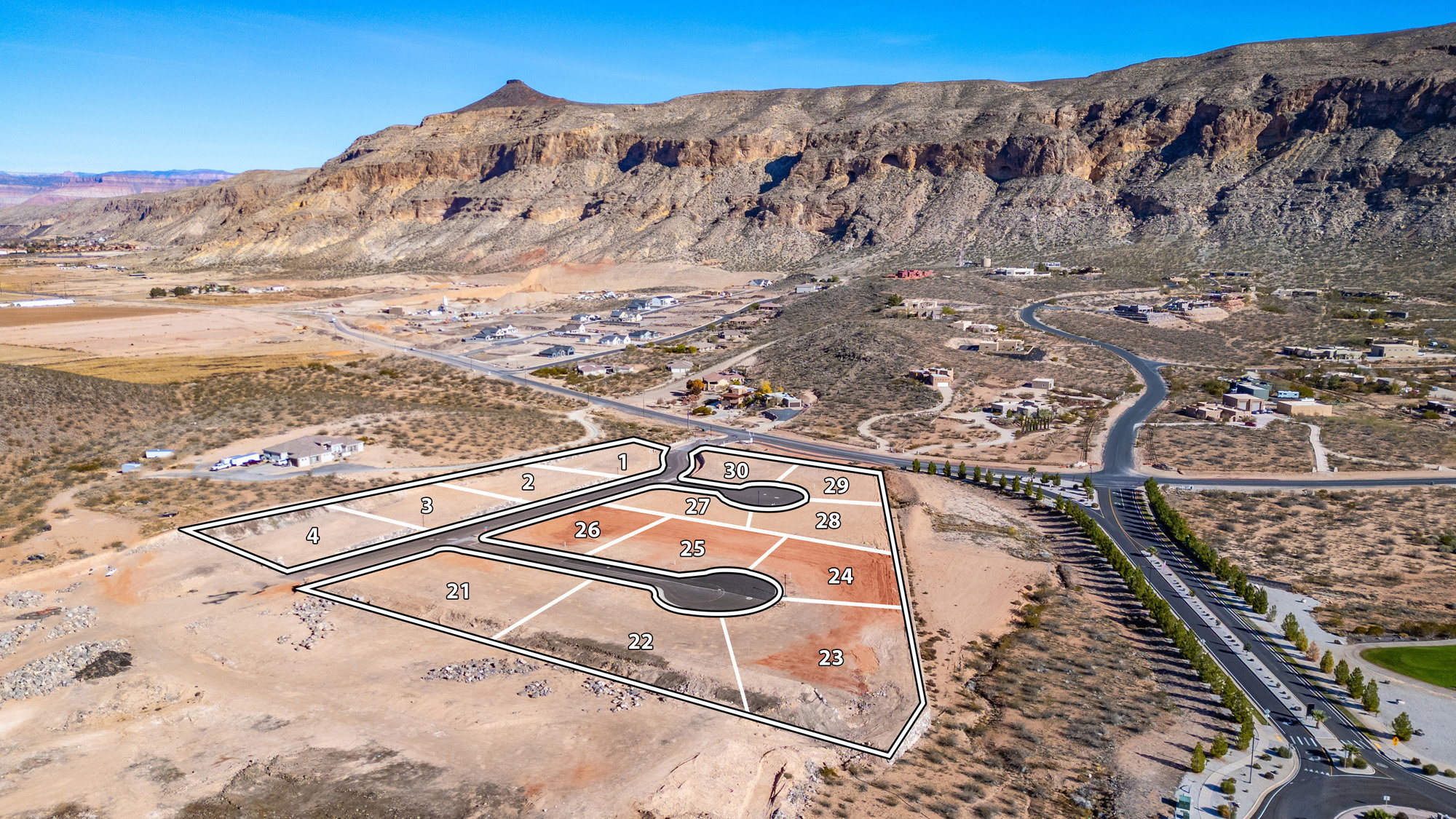 Aerial perspective showcasing a new residential development with multiple numbered lots
