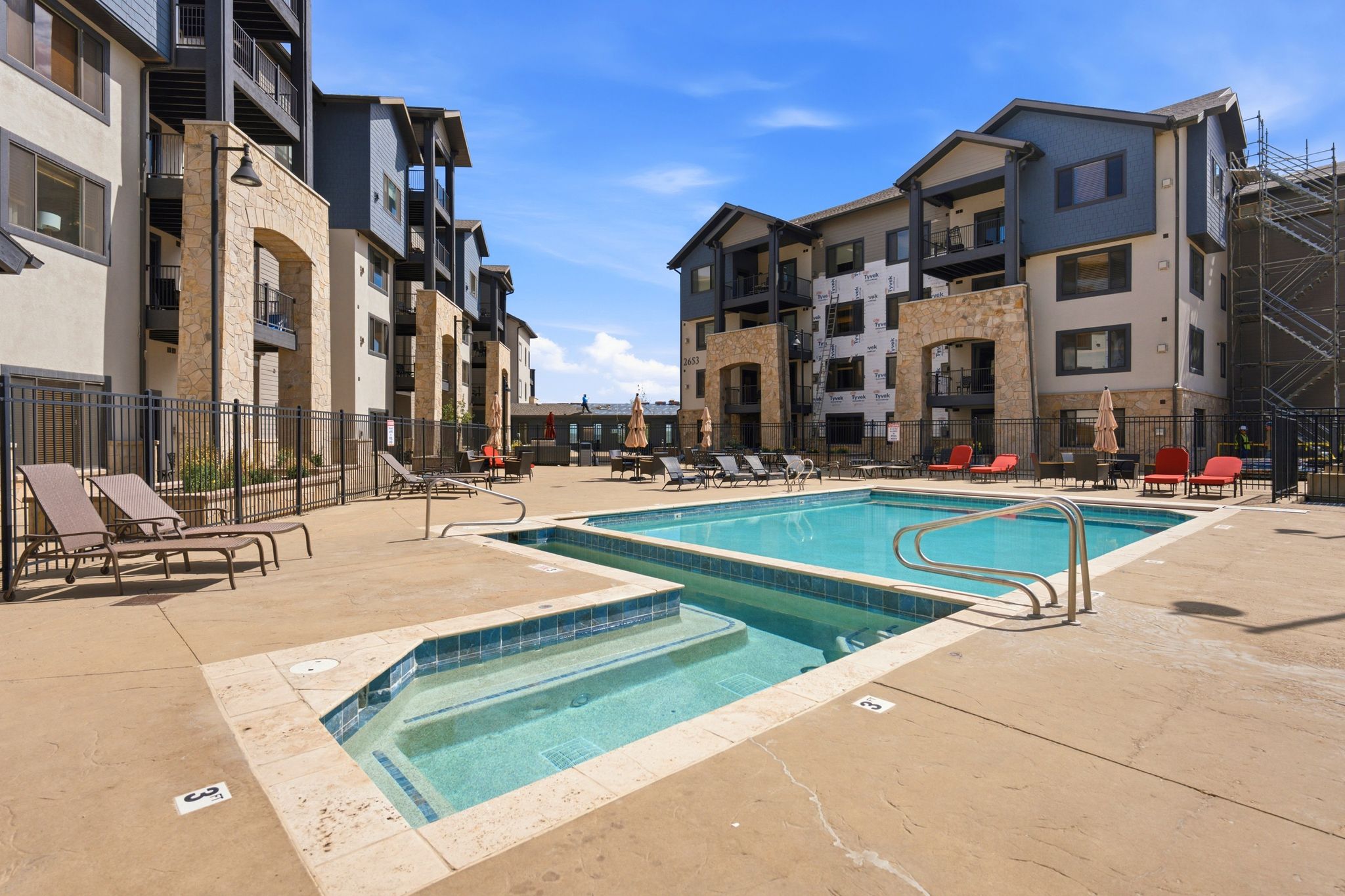 Outdoor swimming pool featuring integrated spa