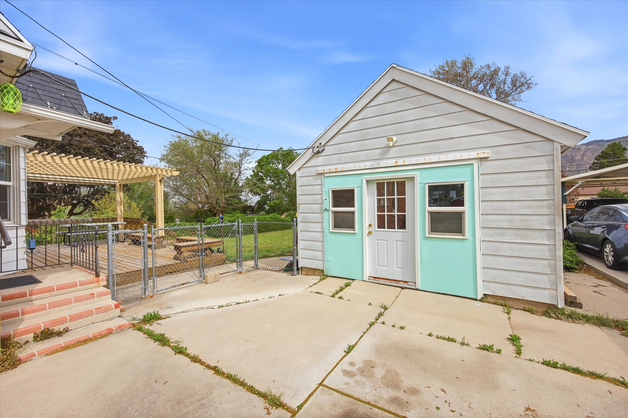 Detached outbuilding with siding exterior and a separate entrance