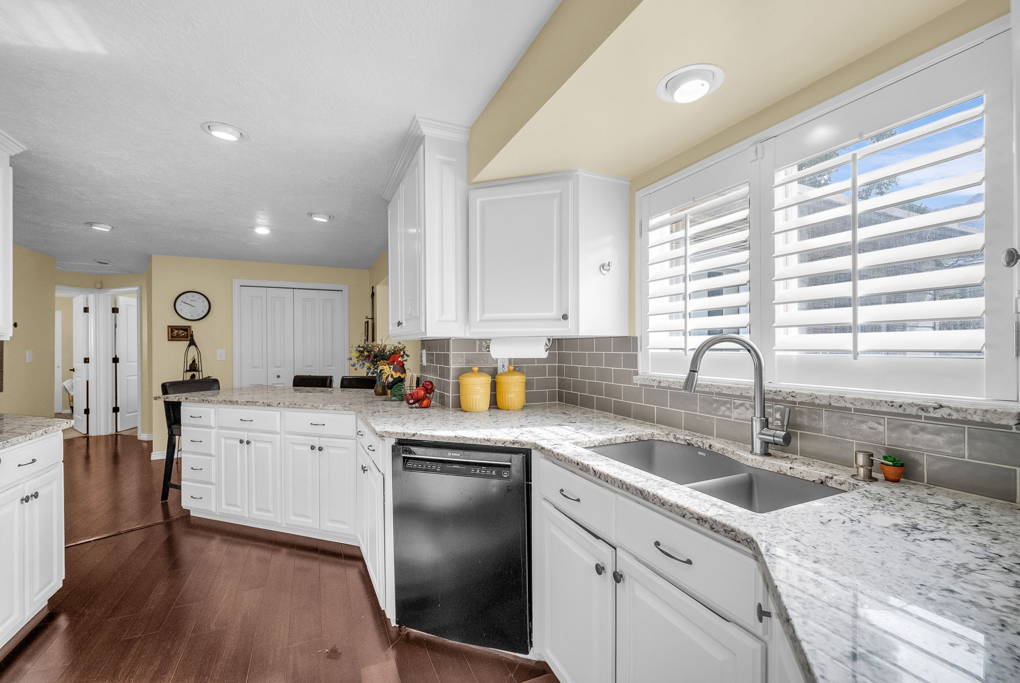 Lovely plantation shutters and undermount sink