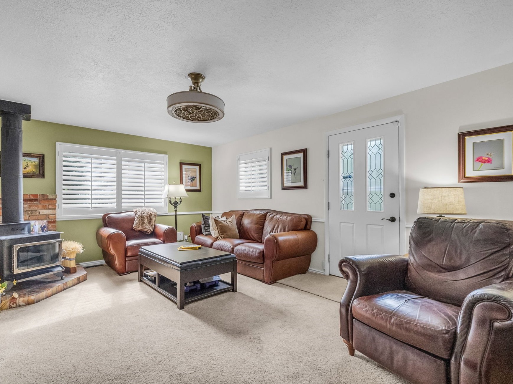 Featuring a wood burning stove and the exit to the lovely deck out back.