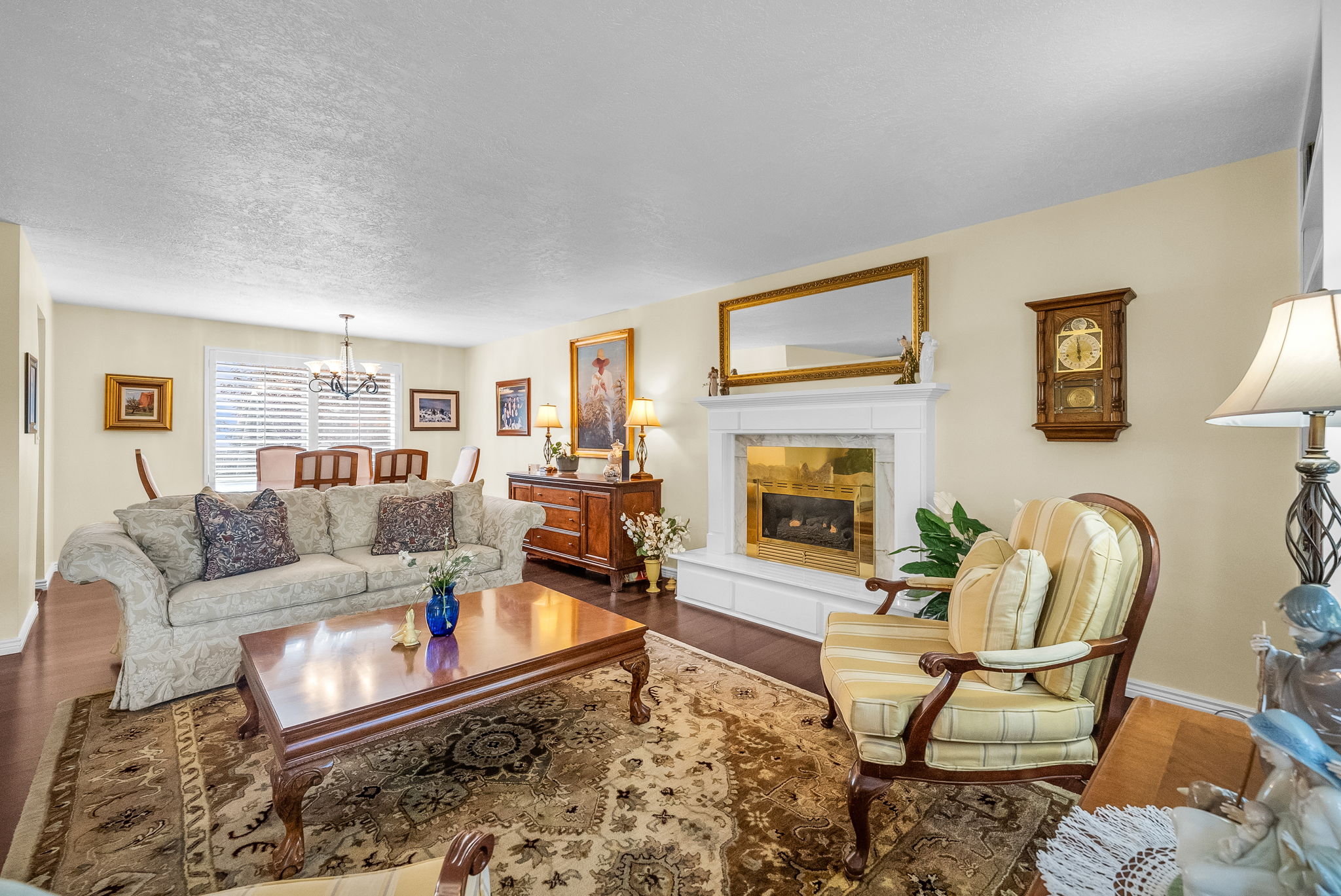 Gas fireplace with decorative white mantle.