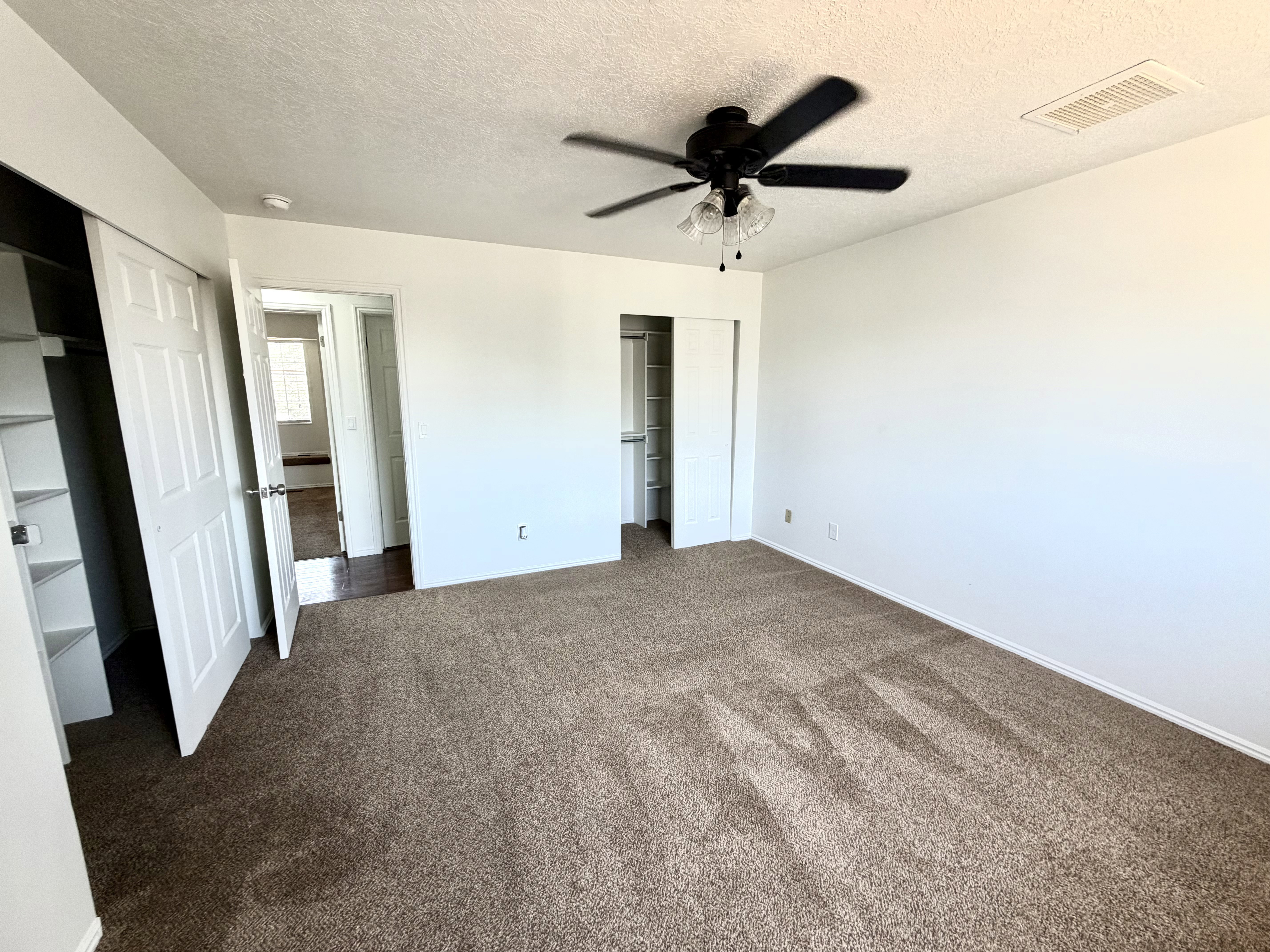 Neutral tone wall paint with textured ceiling