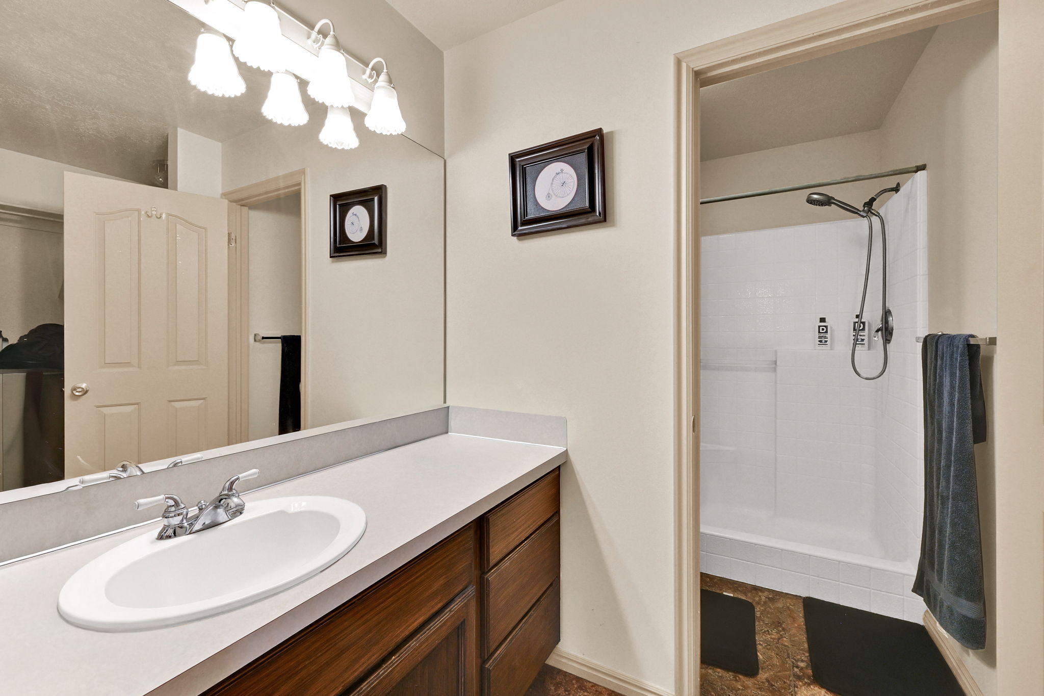 Bathroom featuring a vanity with a white countertop and an undermount sink