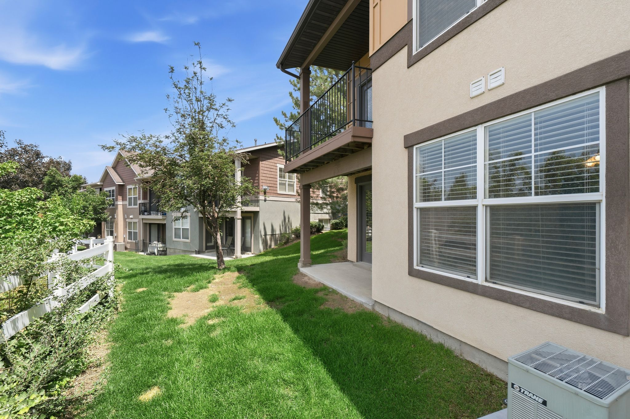 Ground-level patio with direct grass access