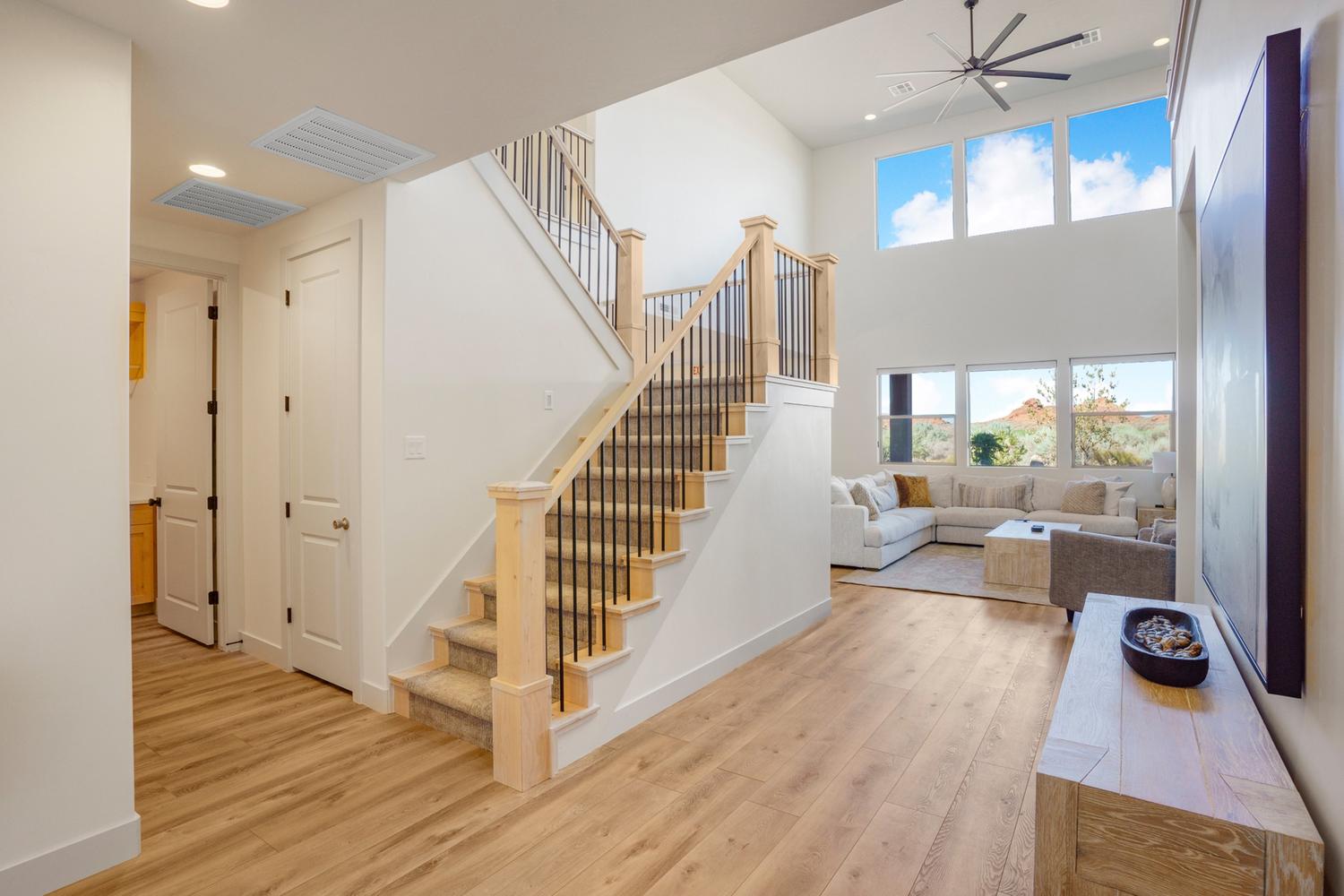 Light wood-finish flooring throughout the main level