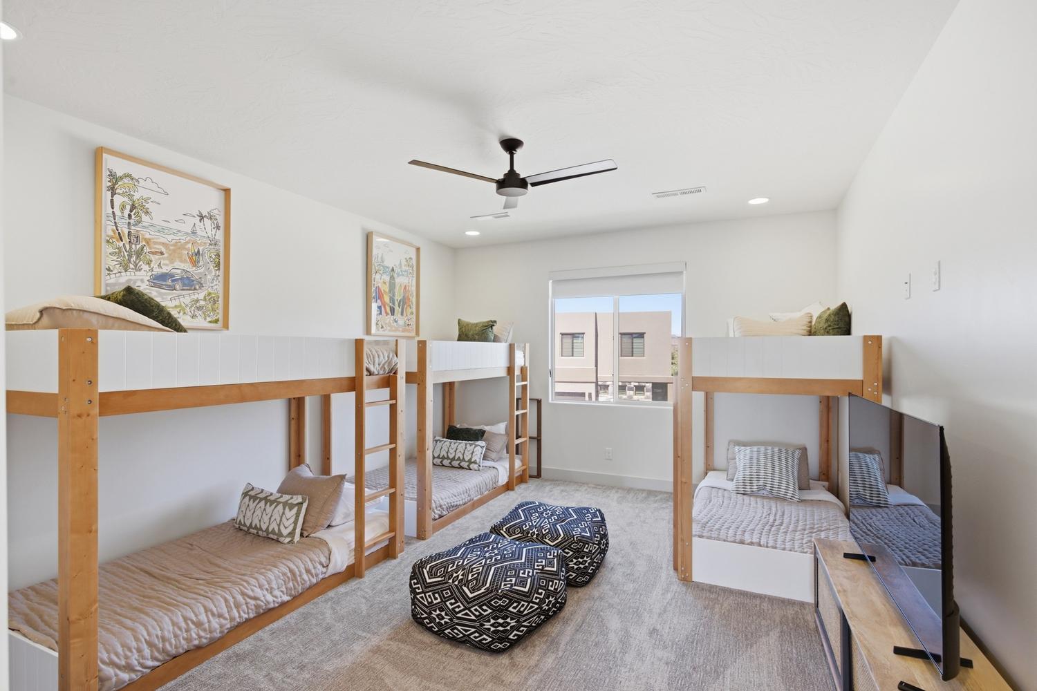 Room featuring multiple bunk beds, recessed lighting, and a ceiling fan
