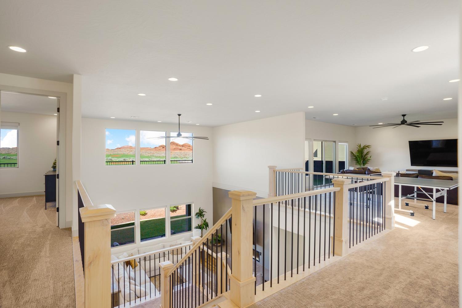 Upper level loft space featuring carpeted flooring and recessed lighting