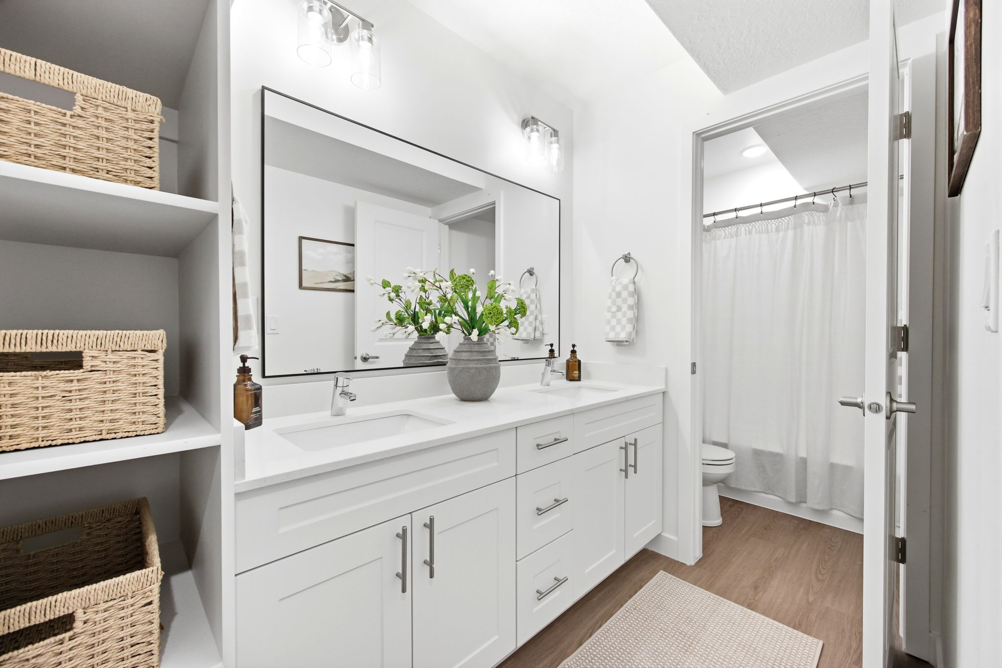 Dual vanity with undermount sinks and white shaker cabinetry