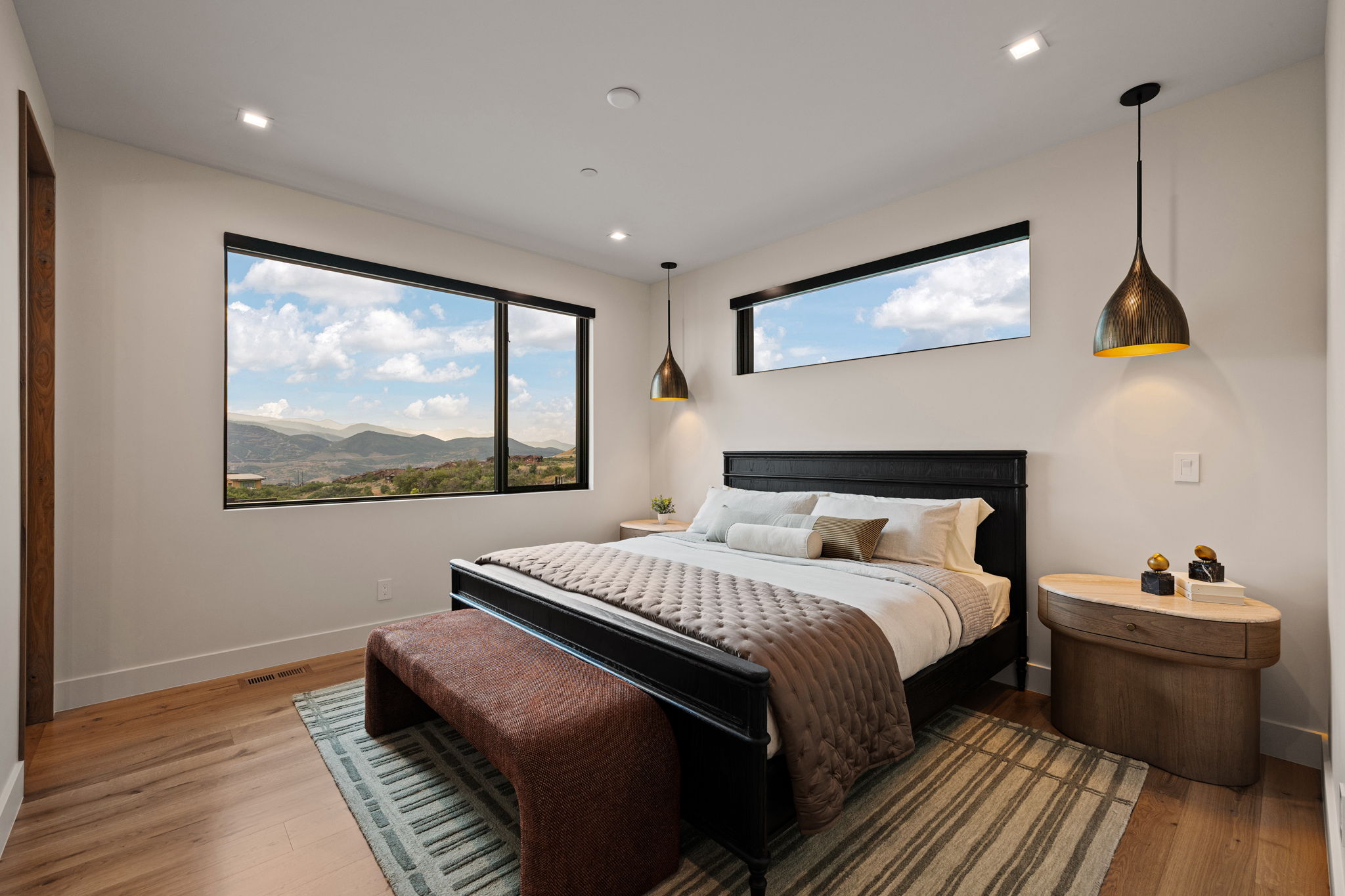 Expansive windows provide abundant natural illumination and highlight the scenic mountain landscape