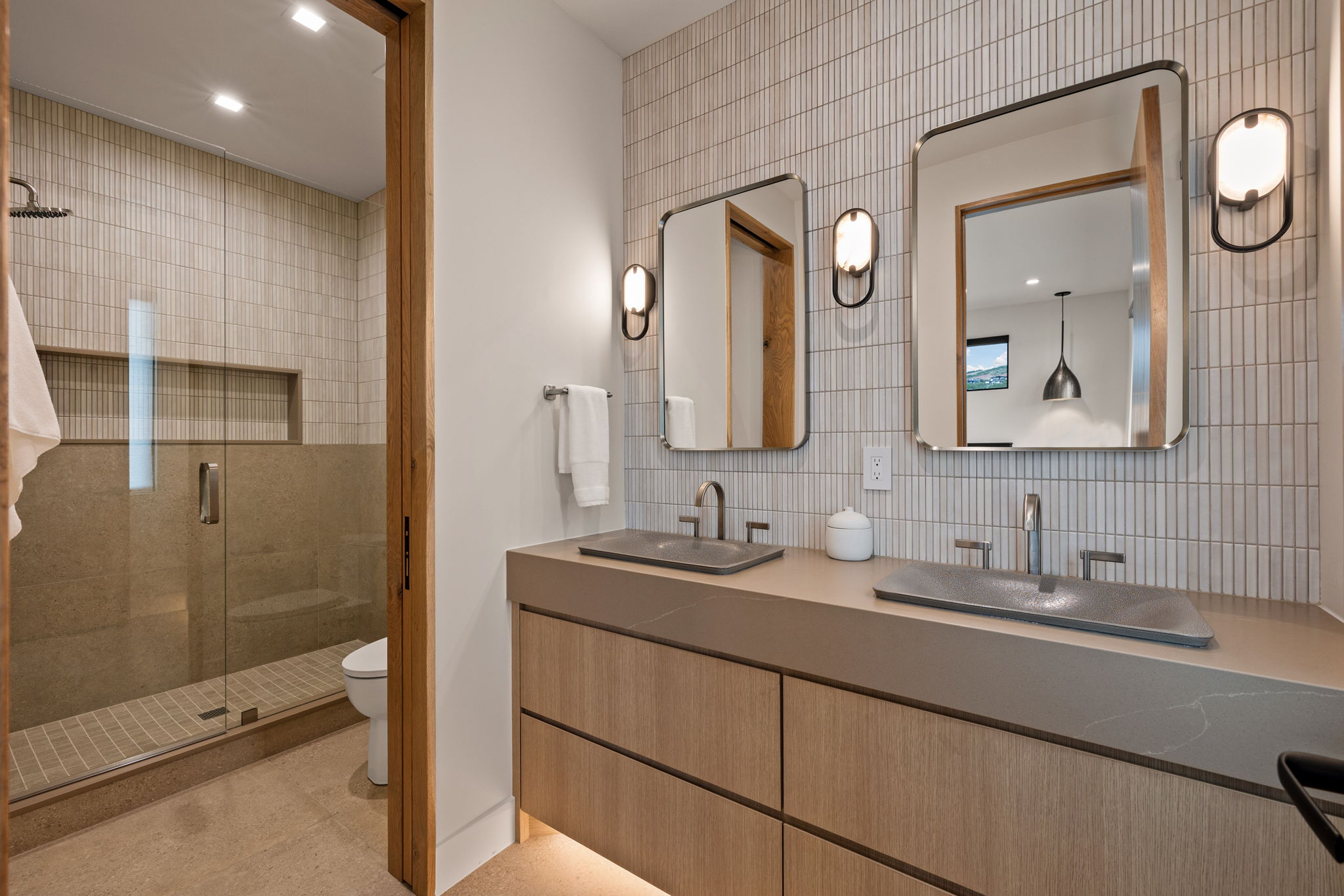Dual vanity with integrated rectangular sinks and wall-mounted faucets