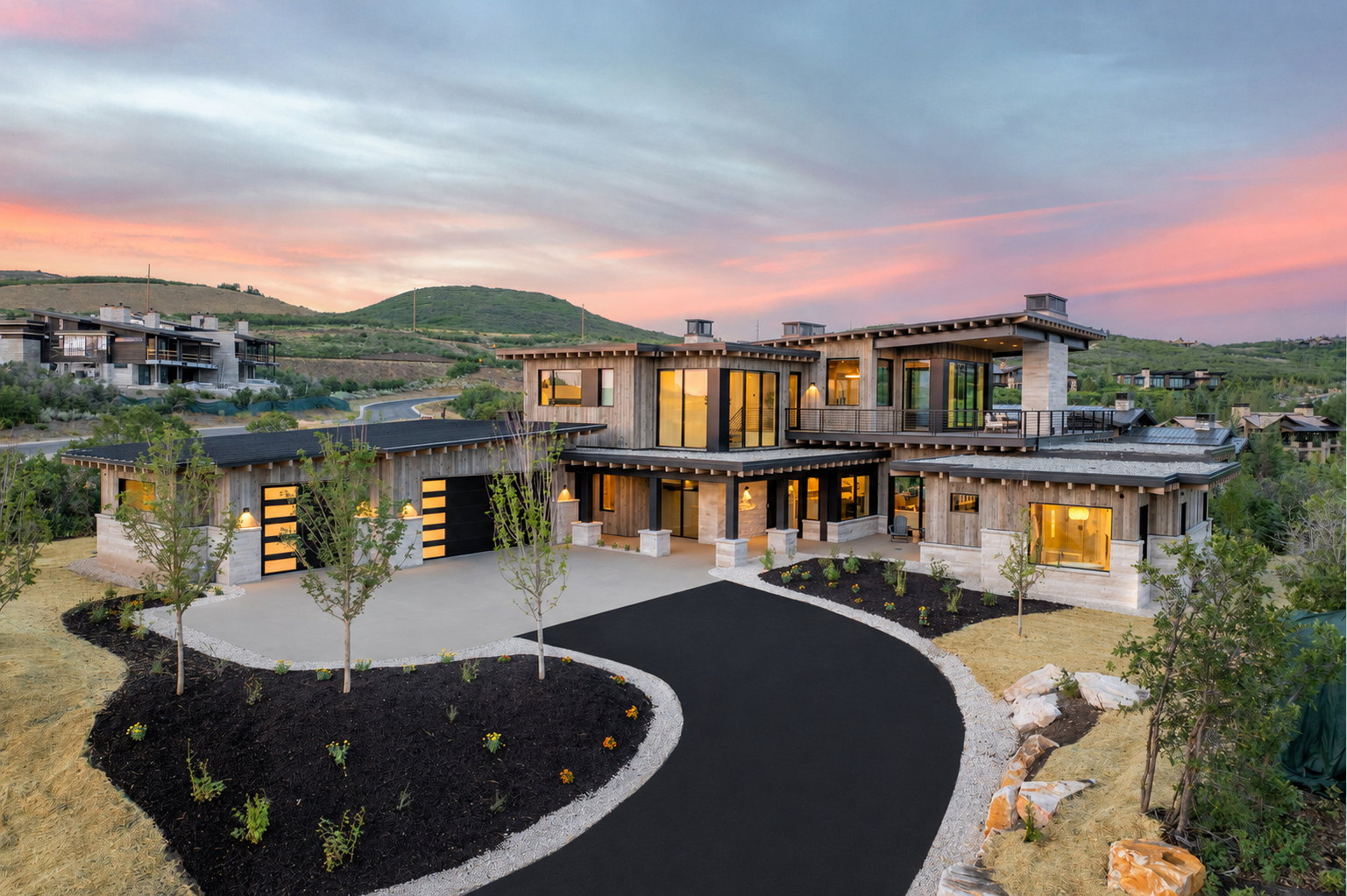 Contemporary-style residence featuring extensive glass panels and multiple balconies