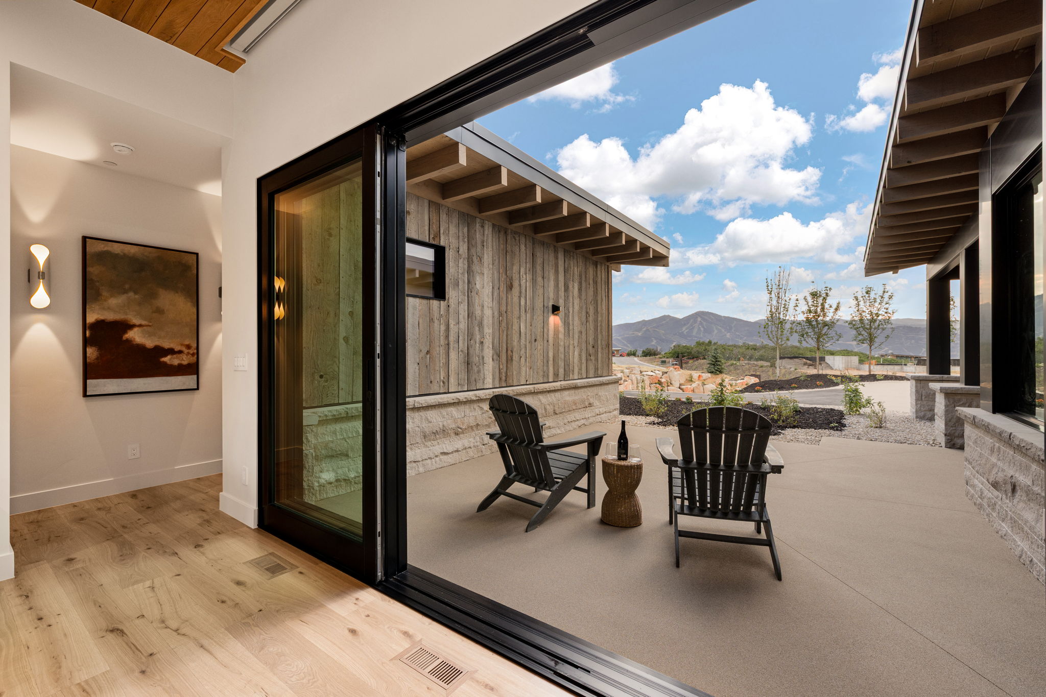 Expansive patio space featuring a concrete surface and mountain views