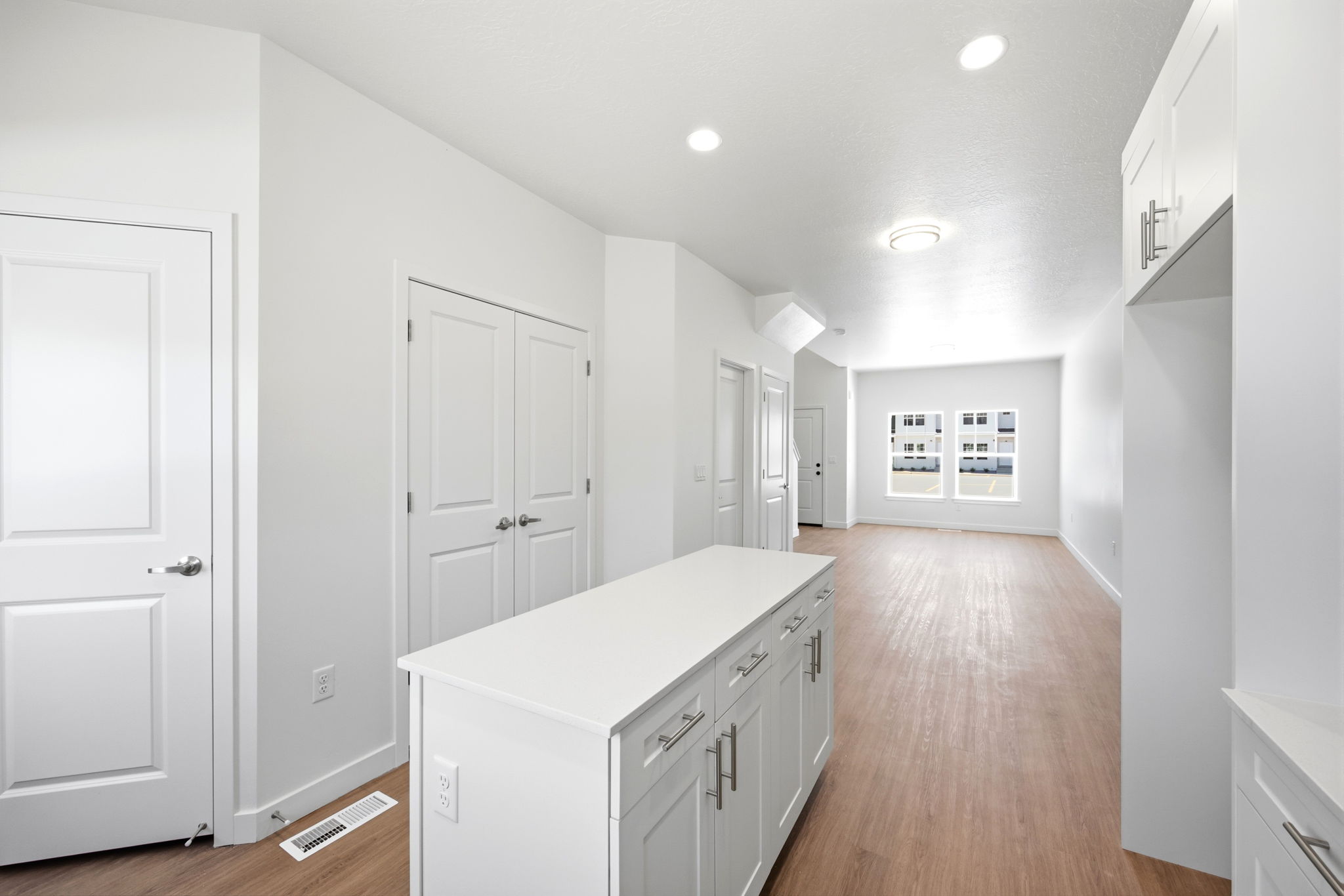 Bright interior featuring wood-finish flooring and recessed lighting