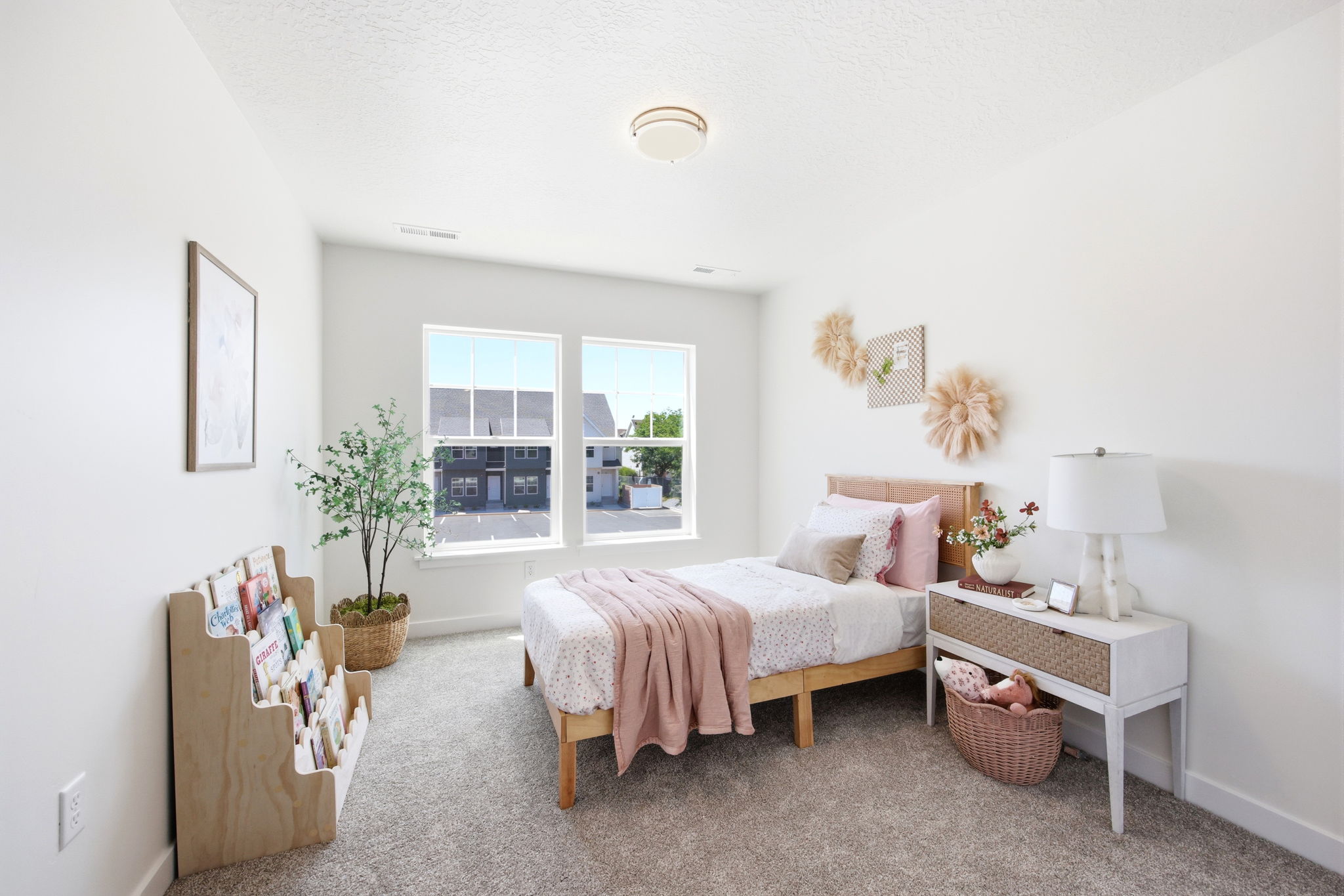 Bright room featuring twin windows and neutral wall tones