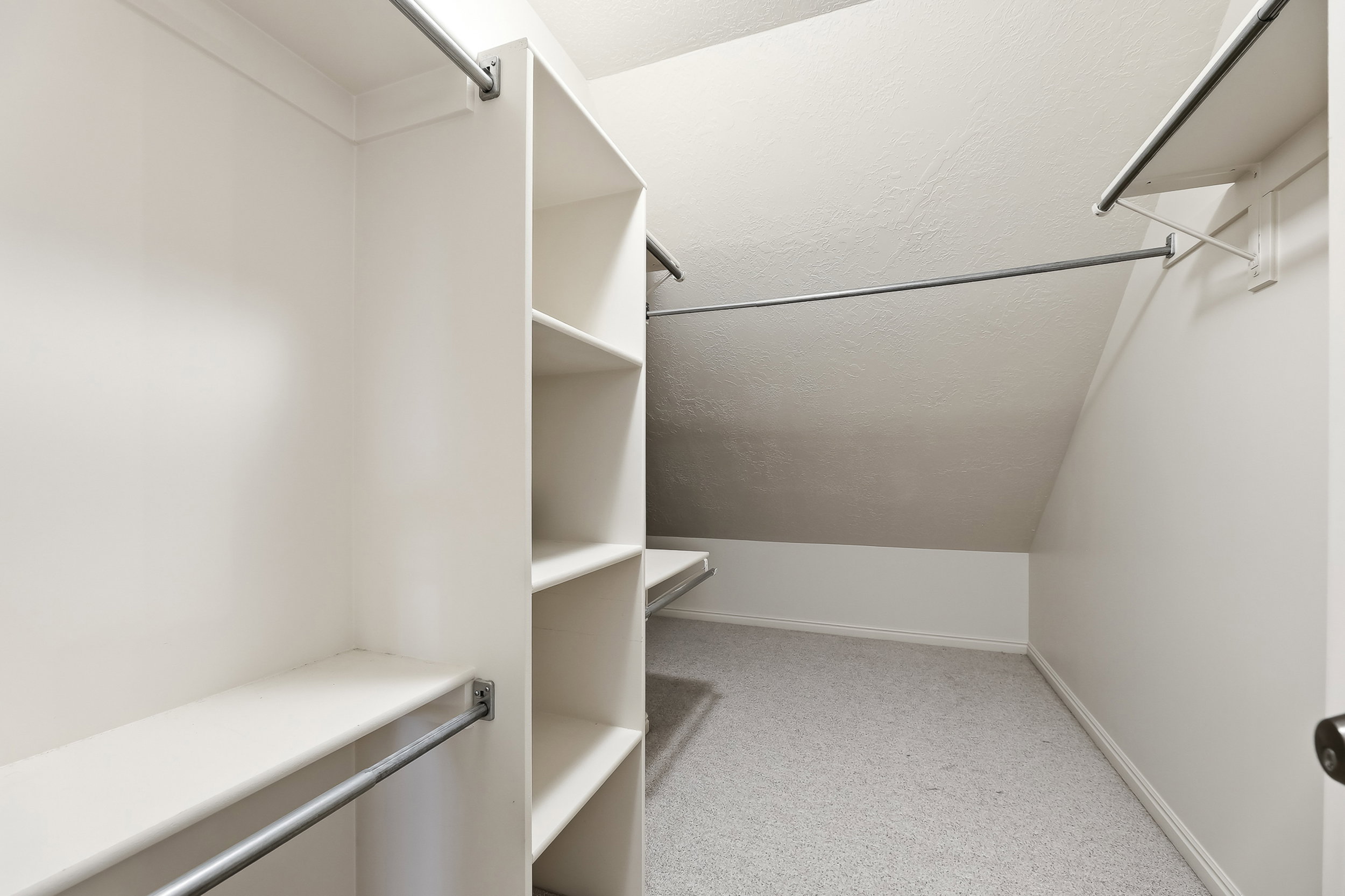 Upstairs Primary Bedroom walk-in closet