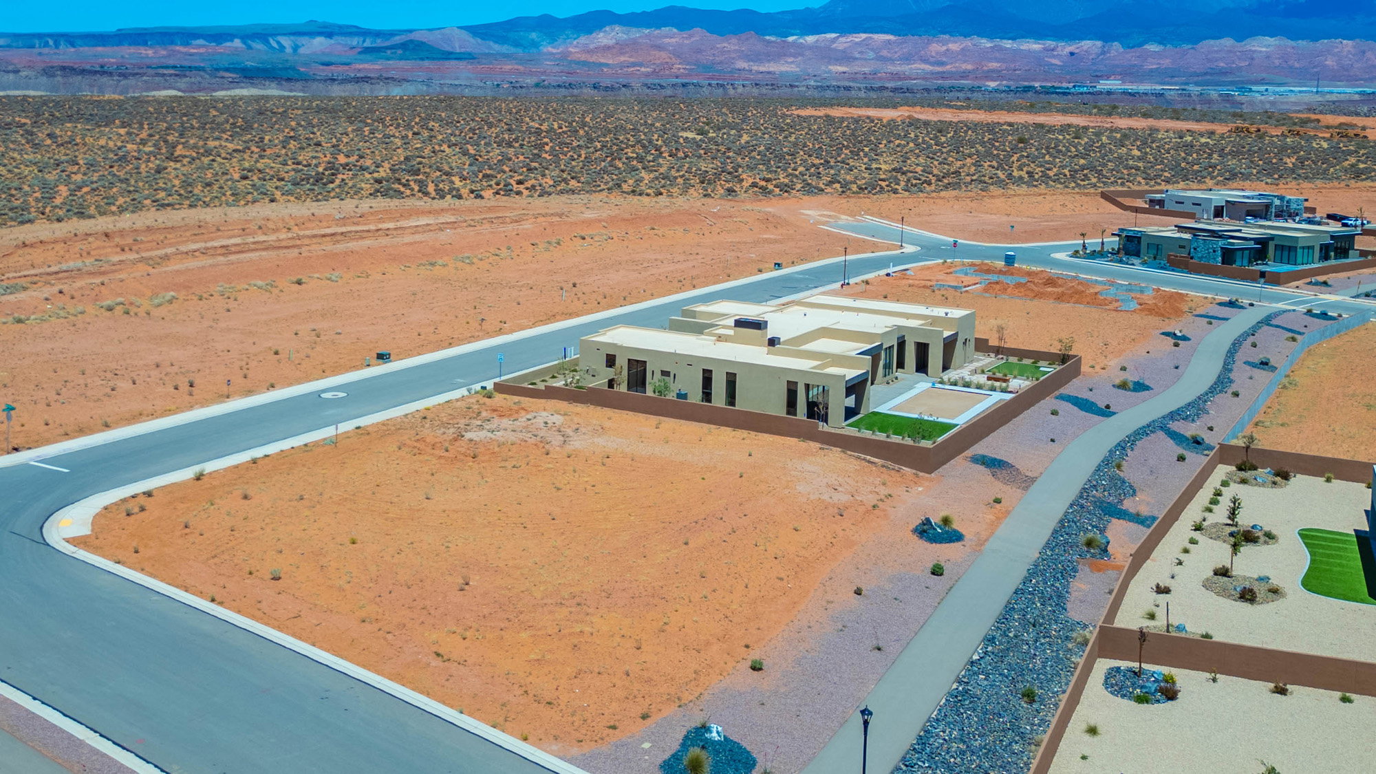 Modern desert landscape featuring a newly constructed residence