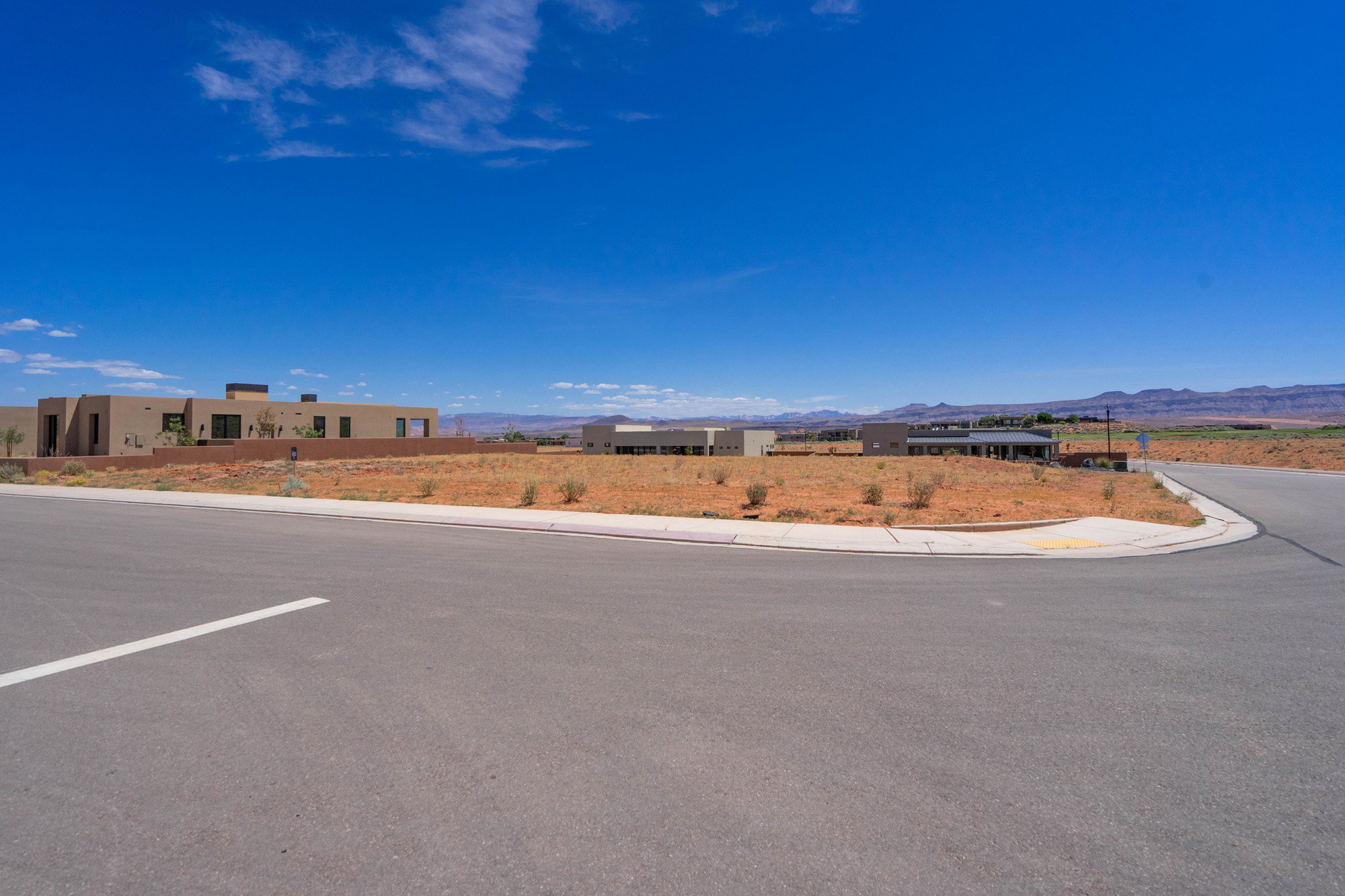 Expansive undeveloped lot presenting clear land and a paved street