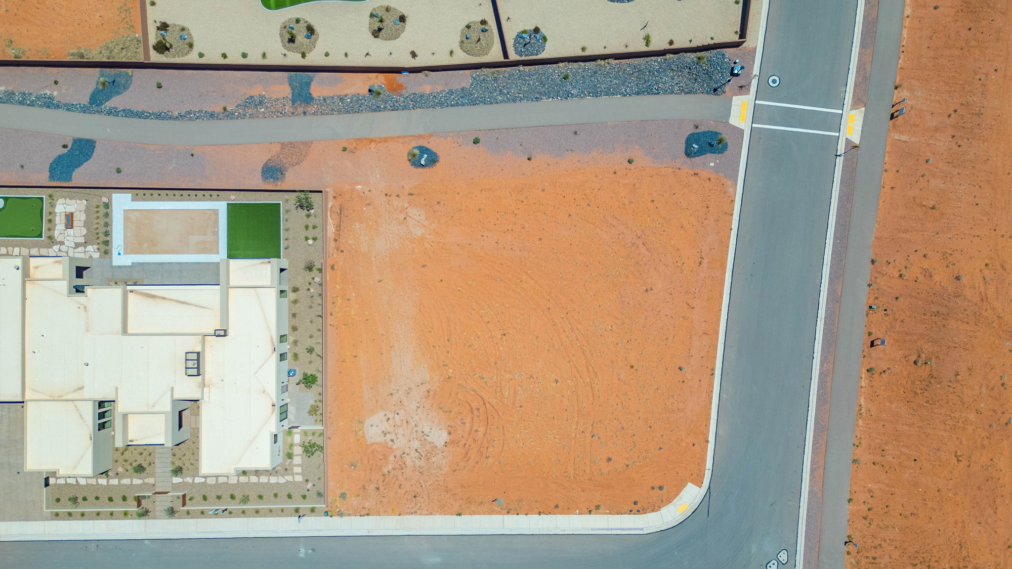 Expansive undeveloped lot featuring direct street frontage and a corner position