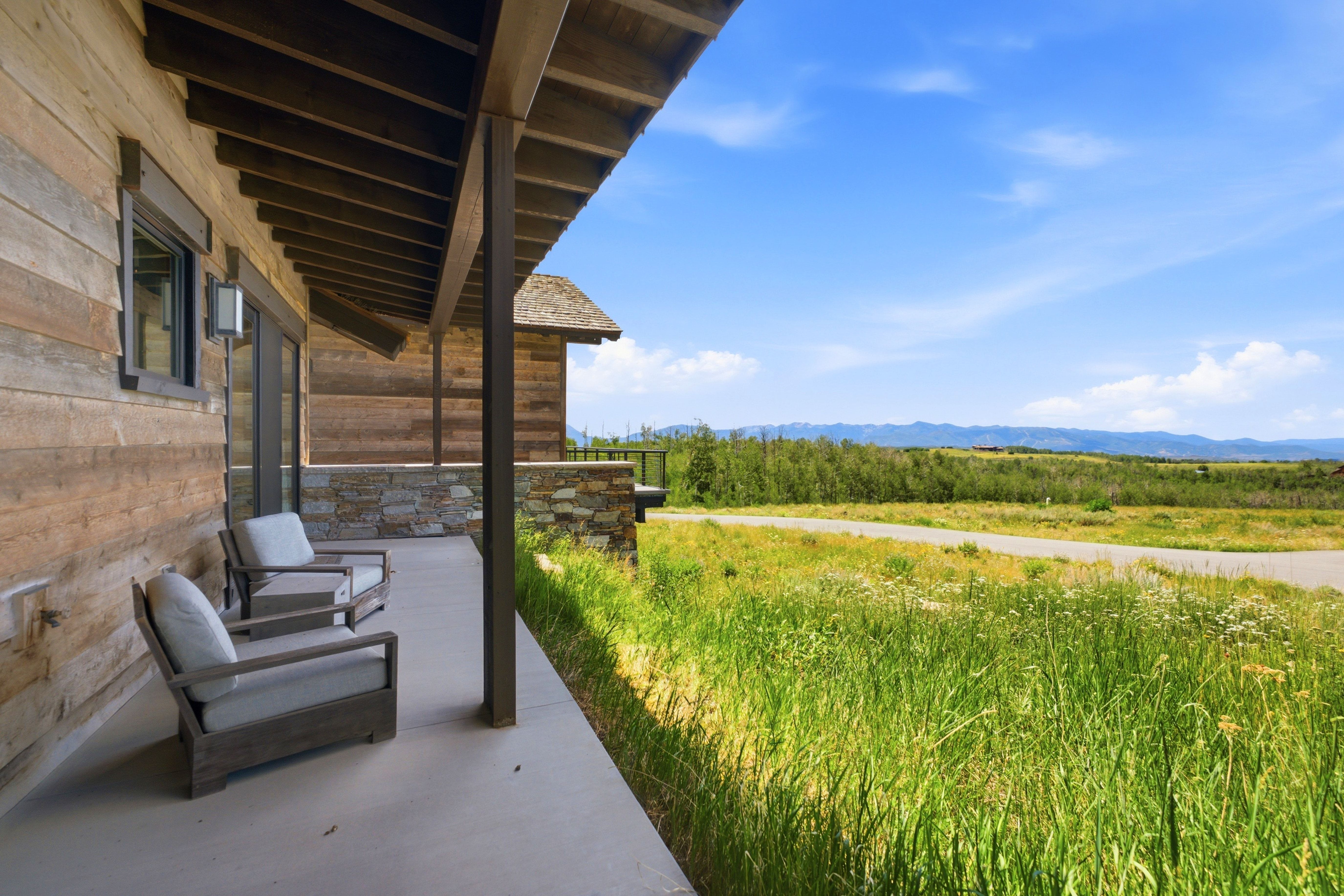 Covered outdoor patio featuring a concrete surface and natural wood-planked ceiling