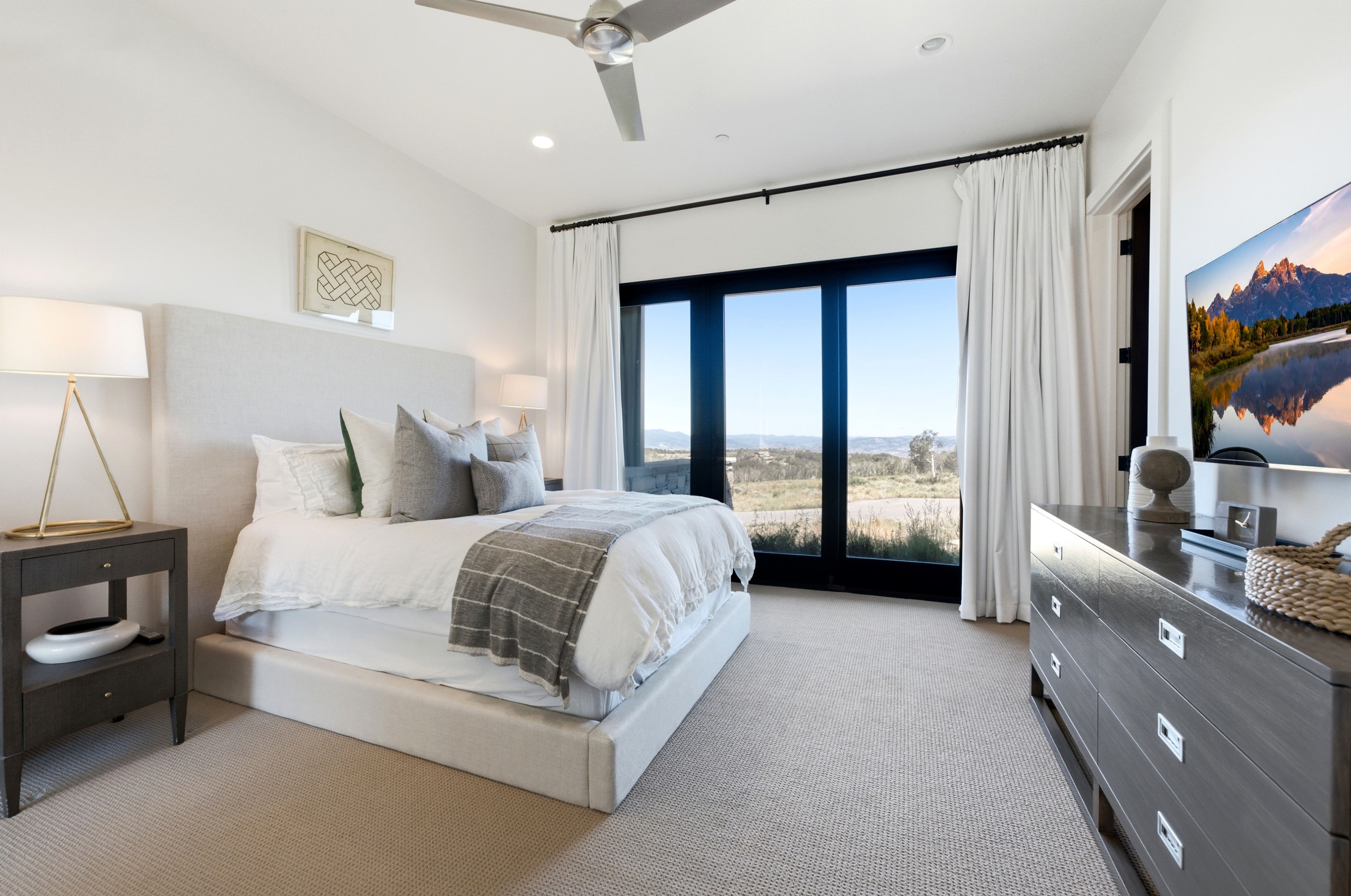 Expansive sliding glass doors provide natural light and outdoor access