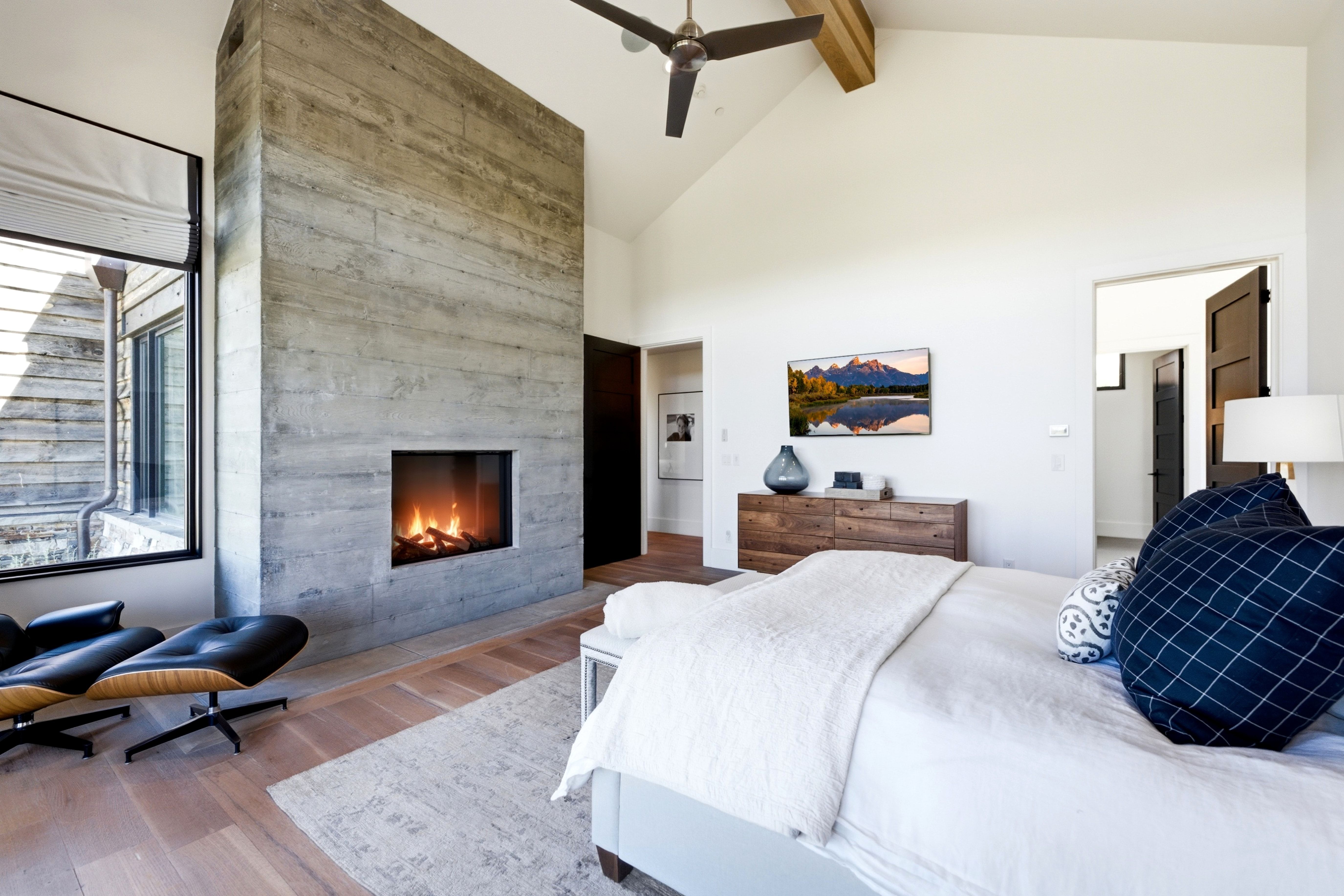 Vaulted ceiling featuring a natural wood beam and ceiling fan