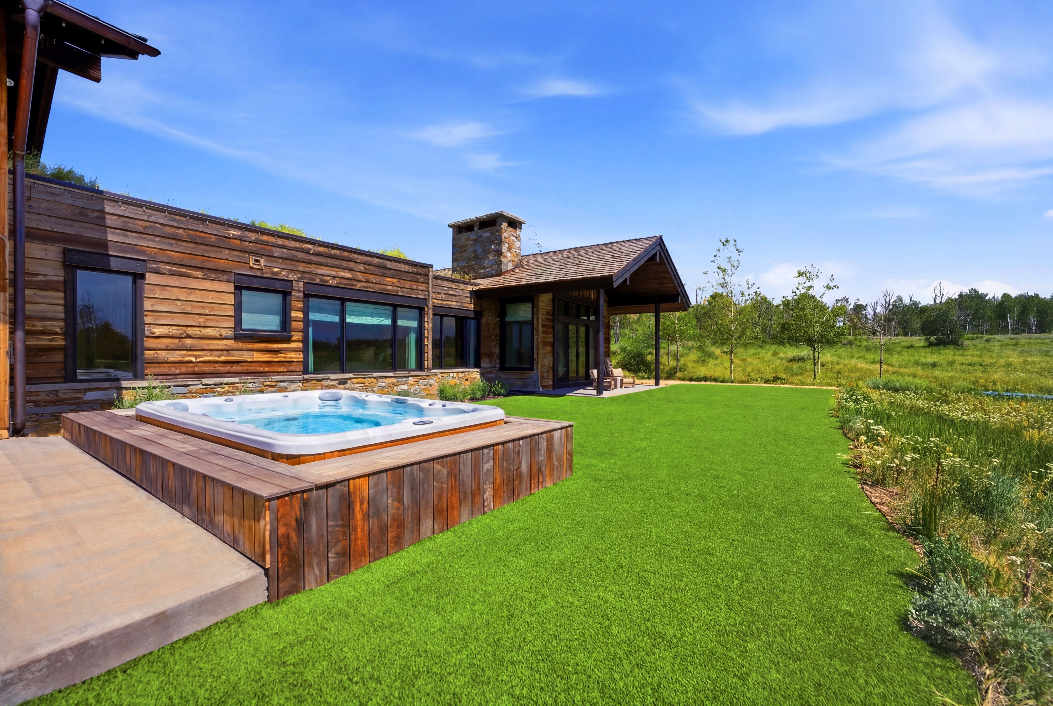 Contemporary exterior featuring natural wood siding and stone accents