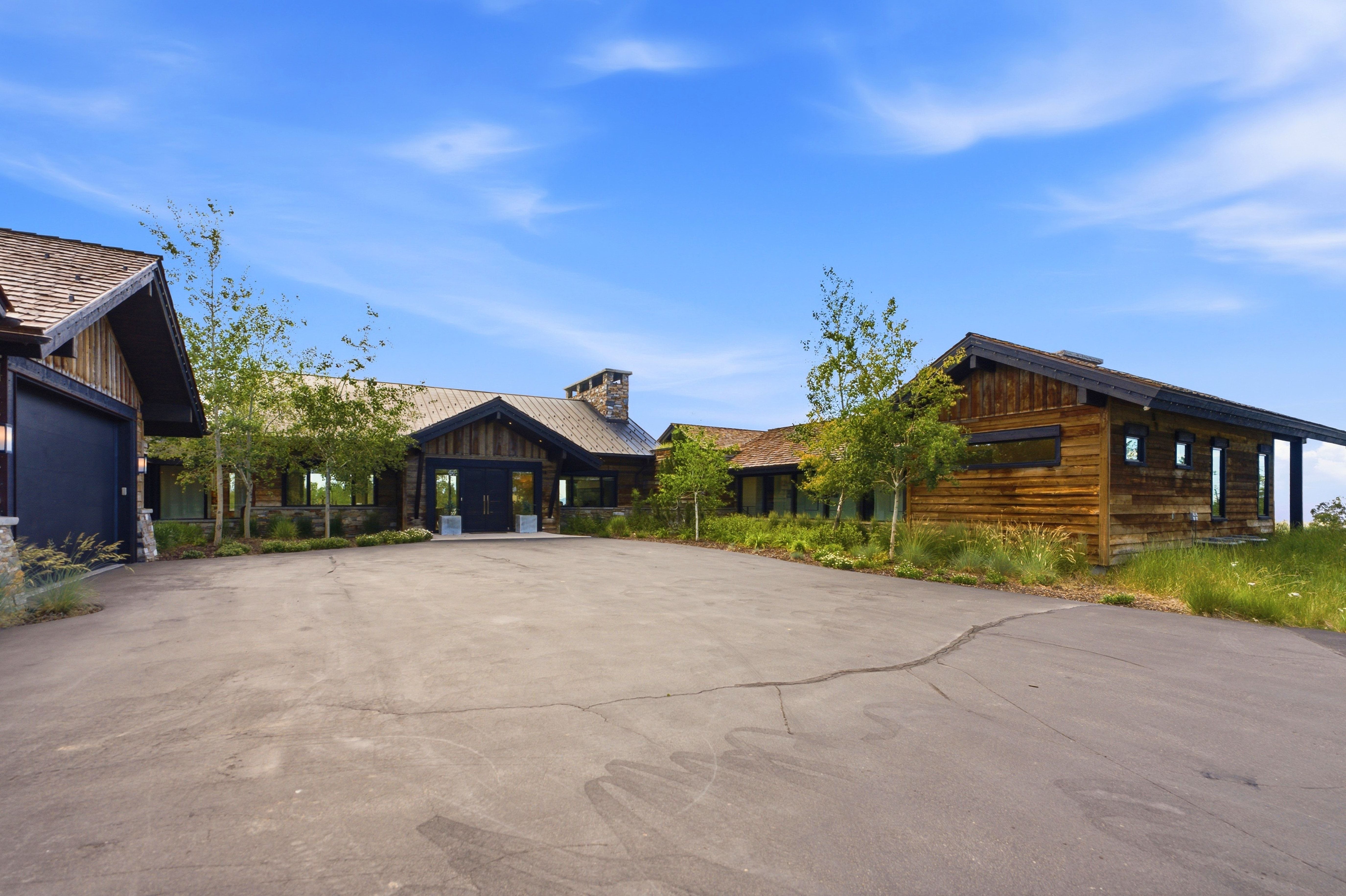 Expansive asphalt driveway providing ample parking
