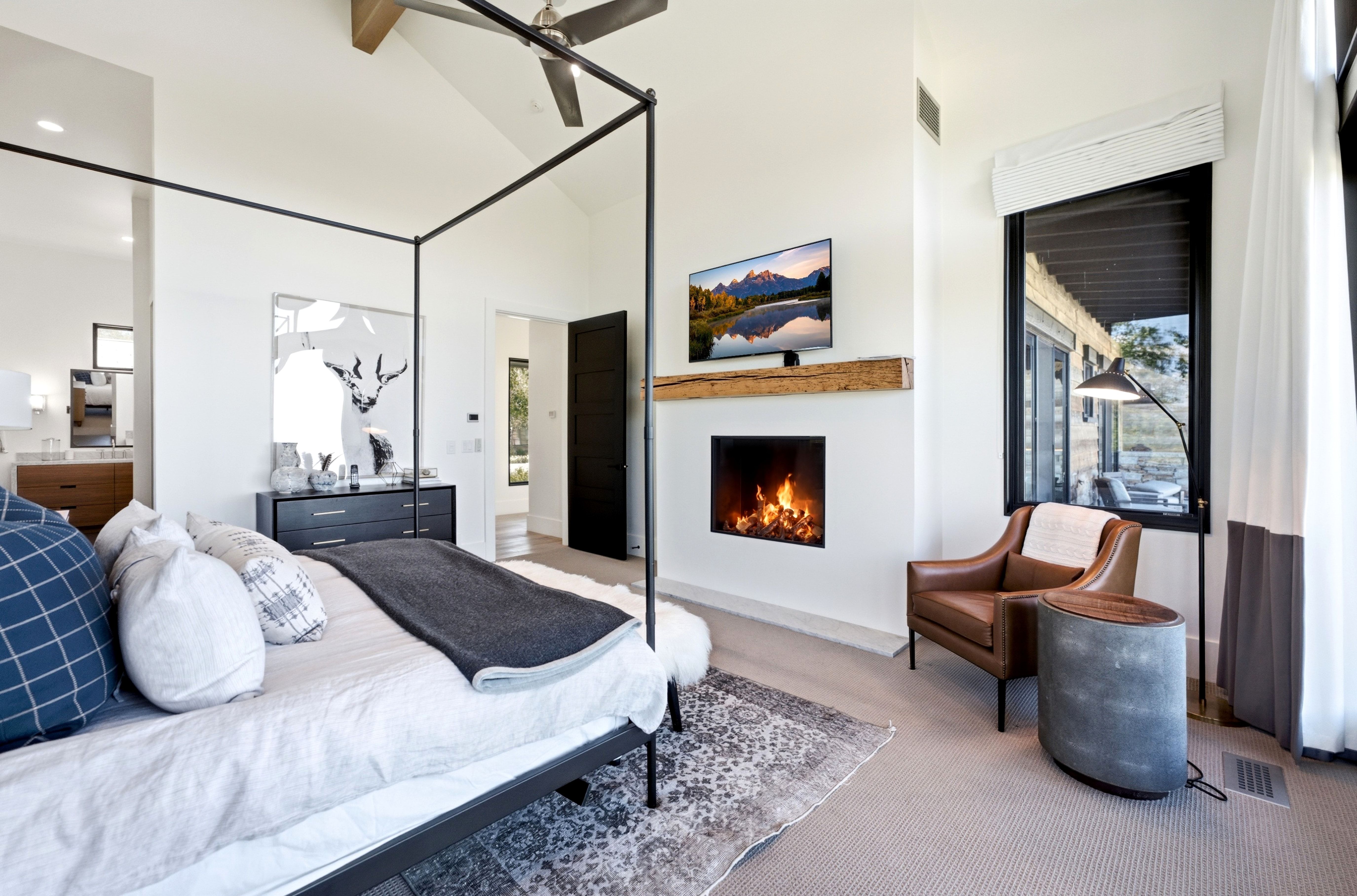 Vaulted ceiling with exposed wood beam and ceiling fan