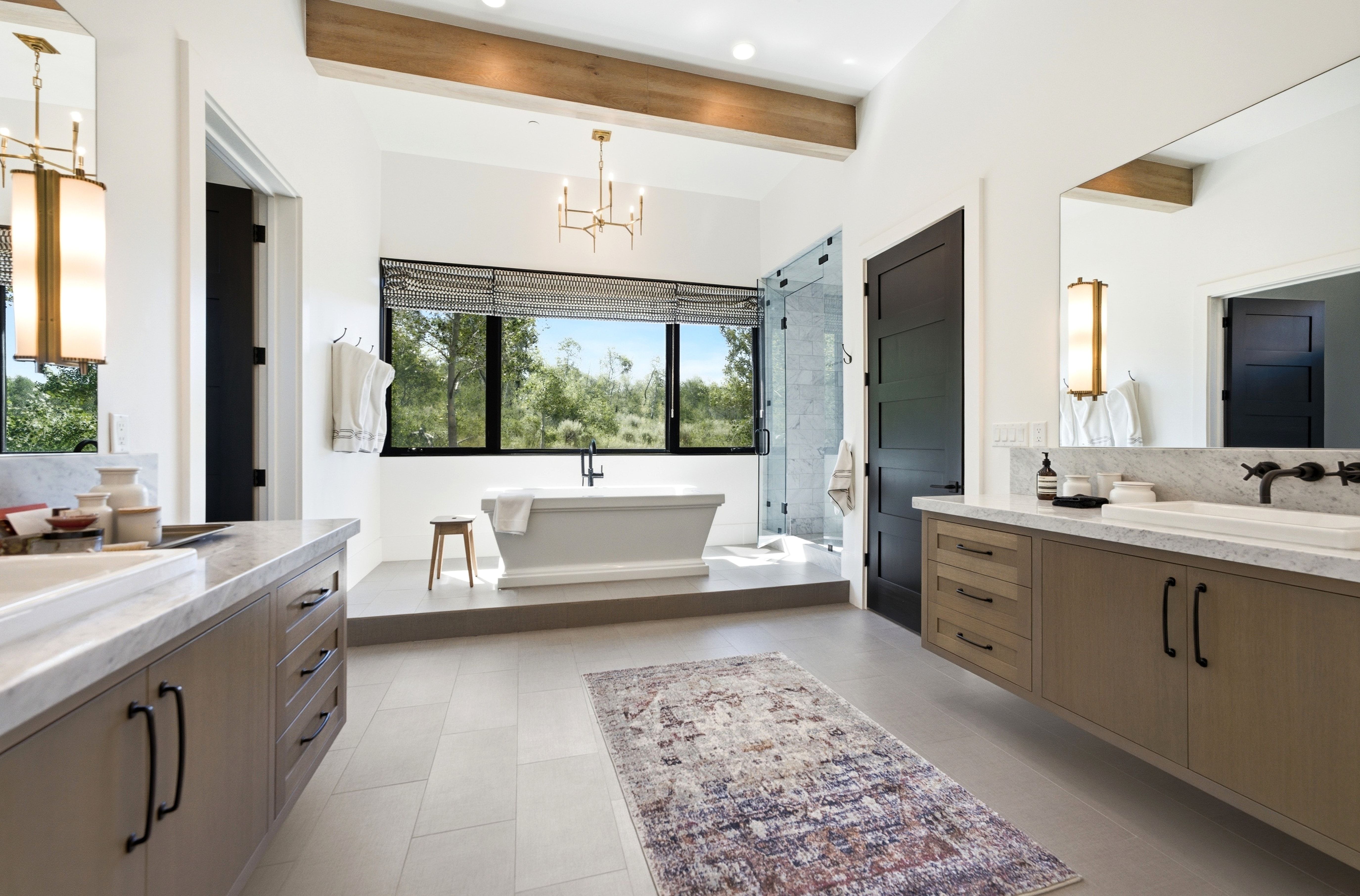Contemporary bathroom featuring dual floating vanities with undermount sinks and stone countertops