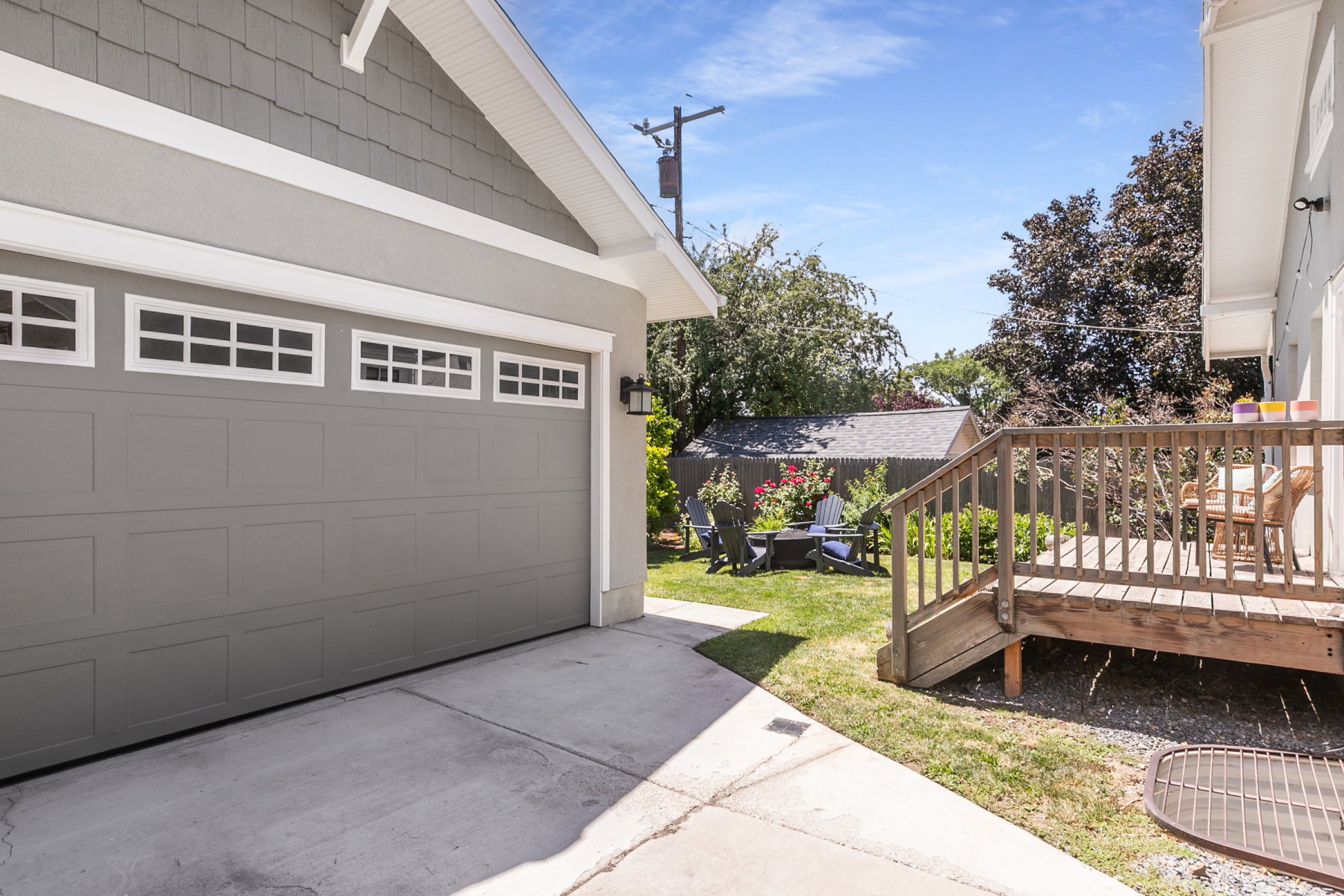 Attached garage with panel door and upper window inserts