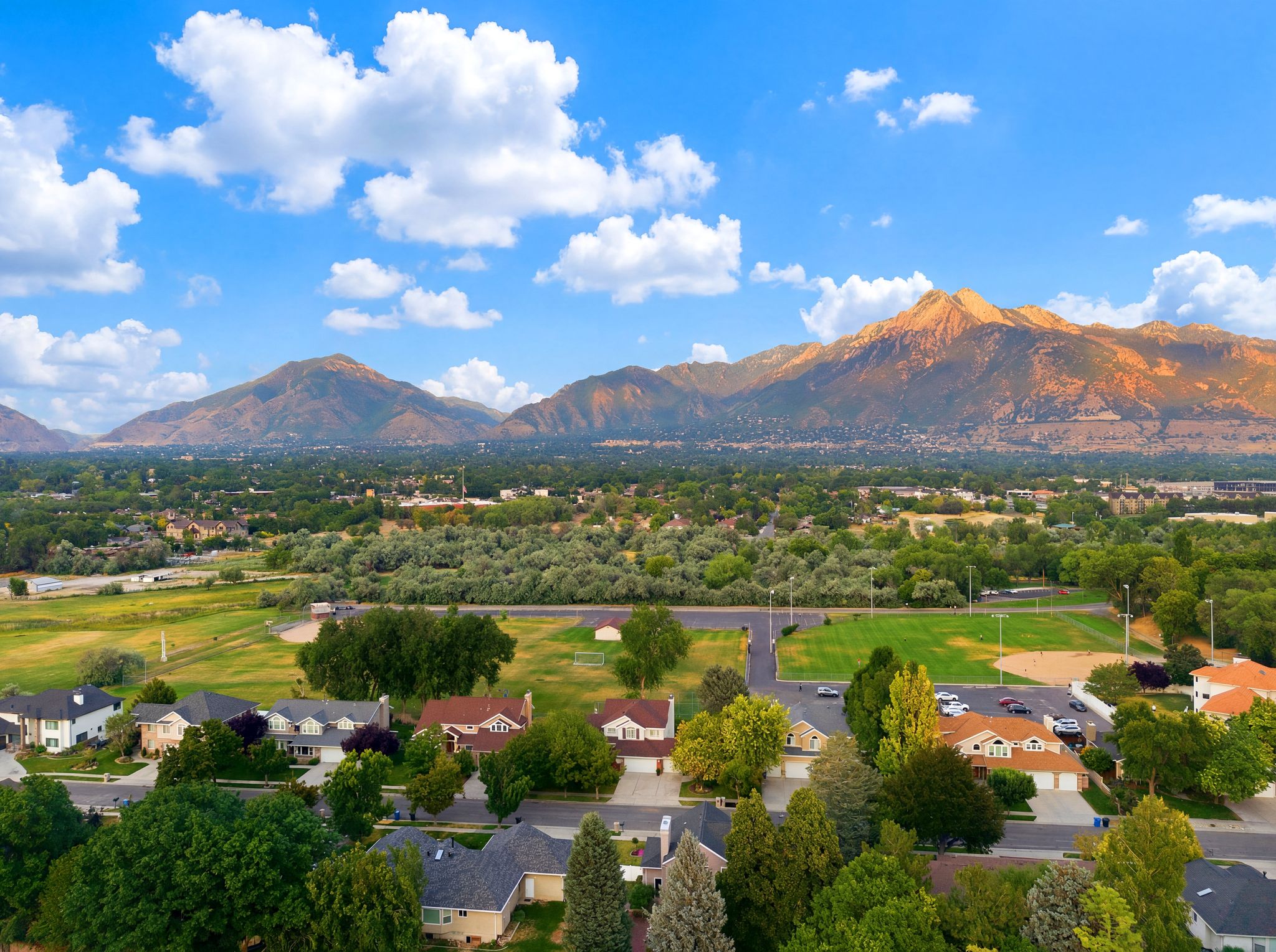 Expansive aerial perspective showcasing a residential neighborhood with varied architectural styles