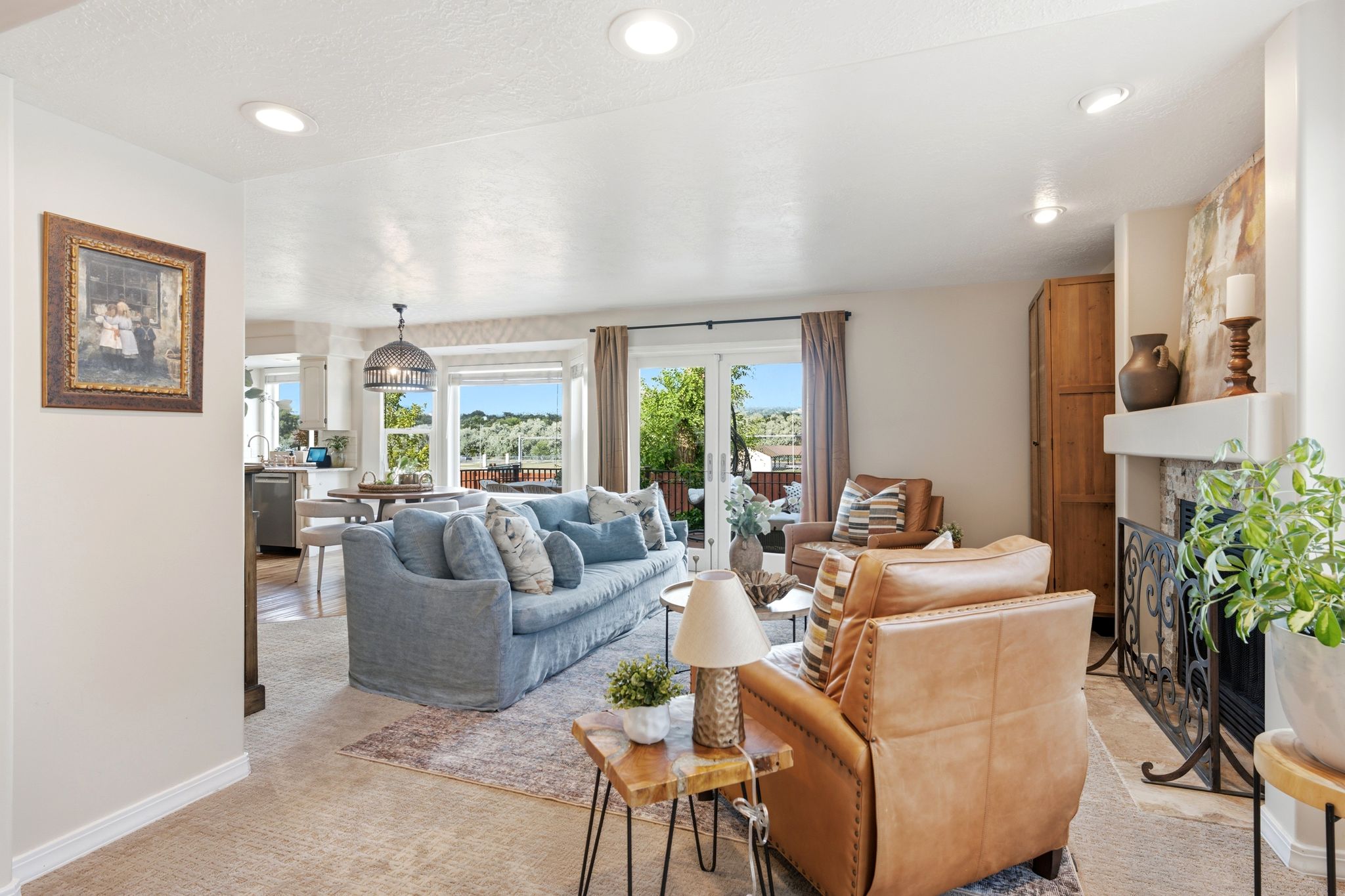 Living space featuring recessed lighting, a built-in fireplace with a decorative screen, and carpeted flooring