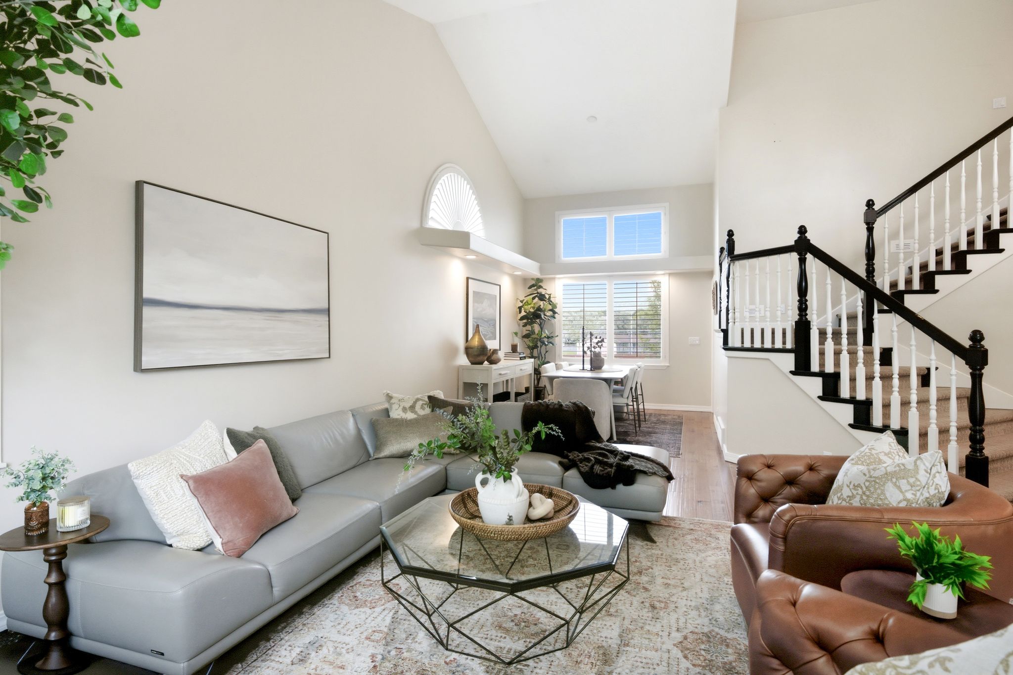 Vaulted ceilings with an arched window accent the main living area