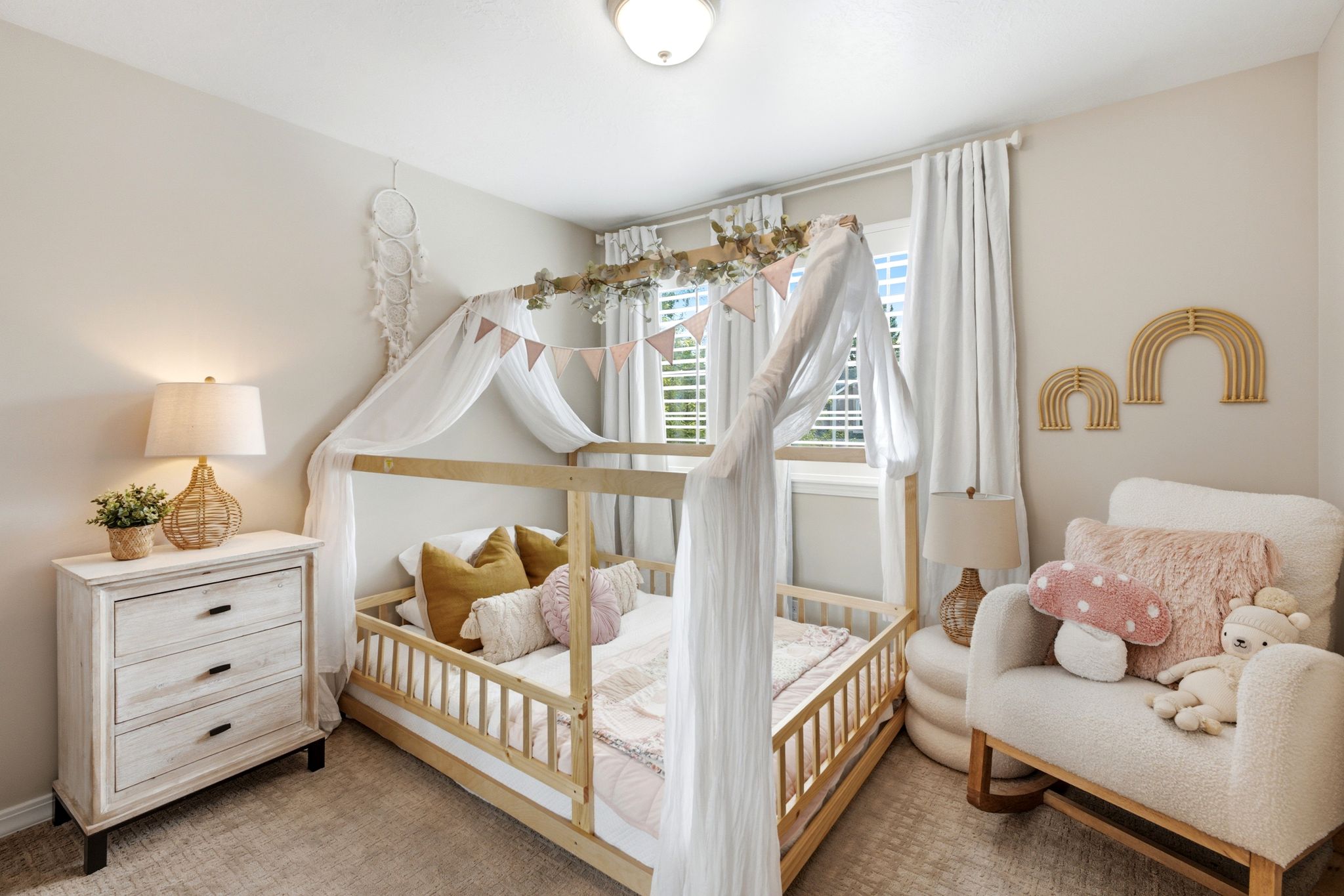 Light-filled room featuring neutral wall tones and carpeted flooring
