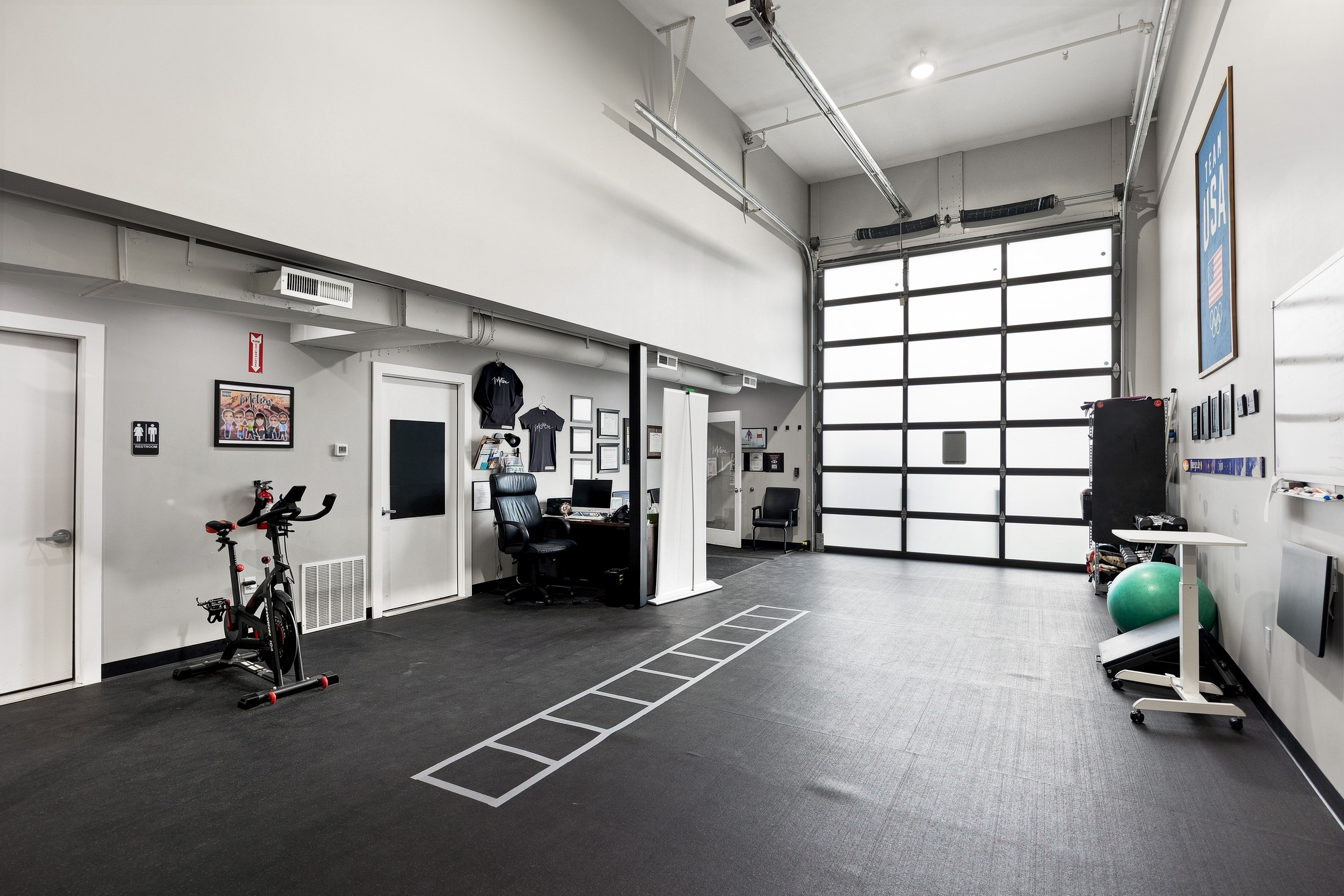 Spacious interior with high ceilings and rubber flooring