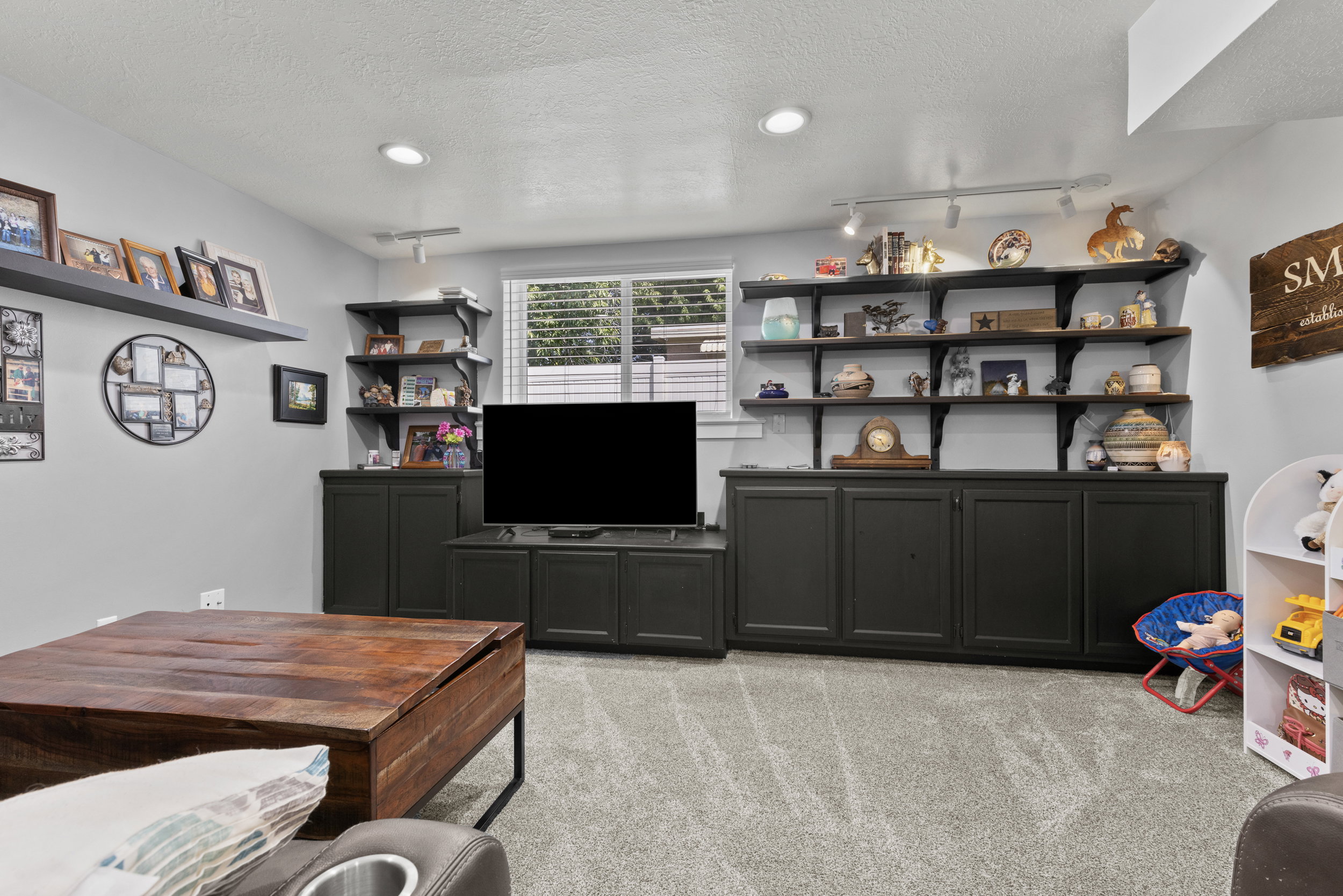 Built-in cabinetry and open shelving provide extensive storage and display options