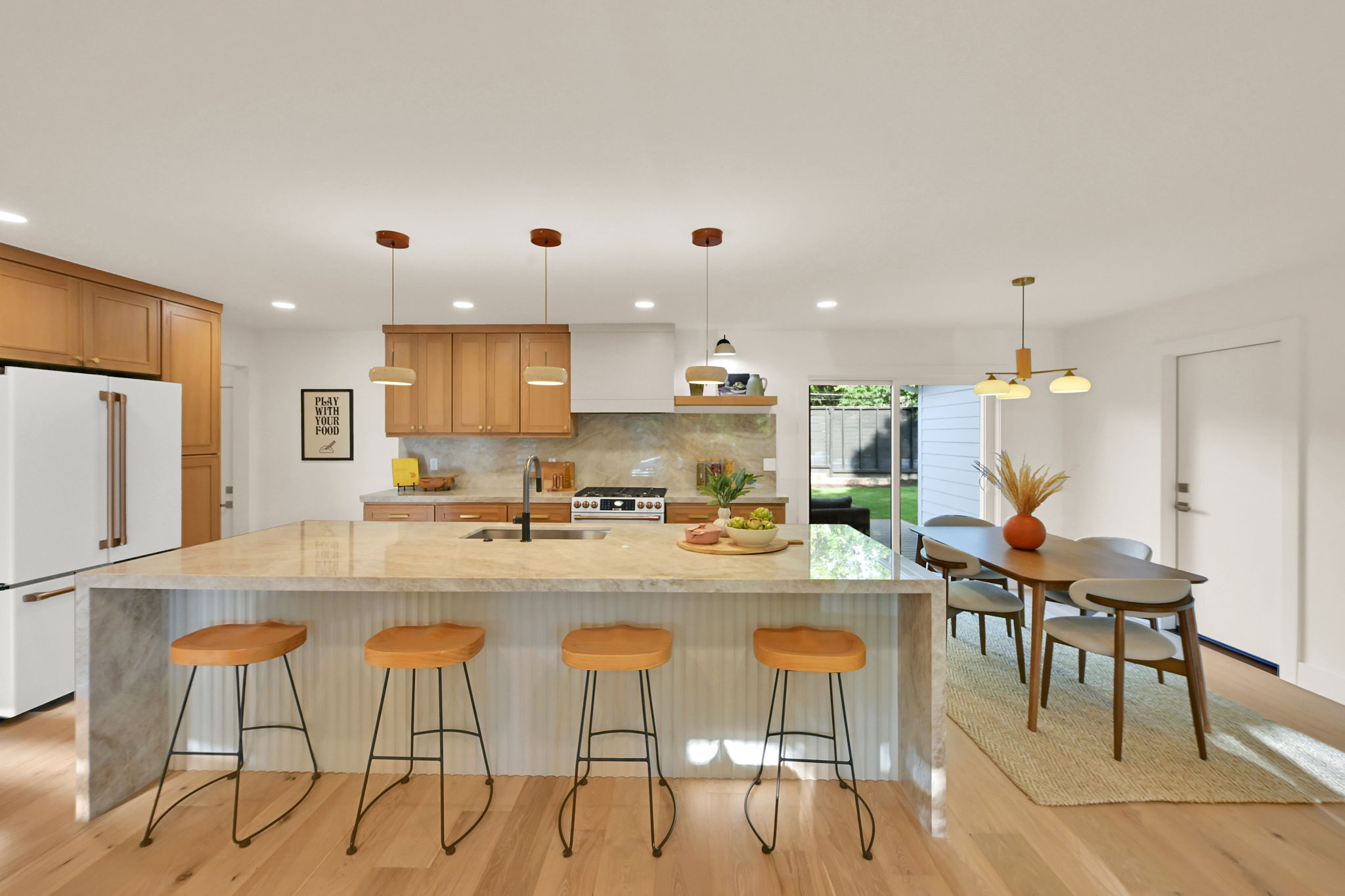 Gourmet kitchen featuring a waterfall island & solid oak cabinetry