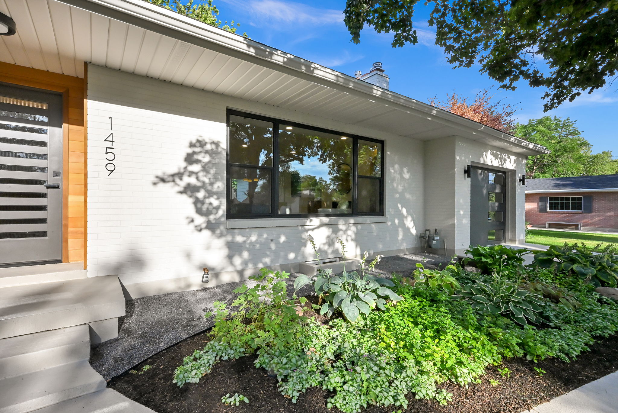 White brick exterior with black window frames