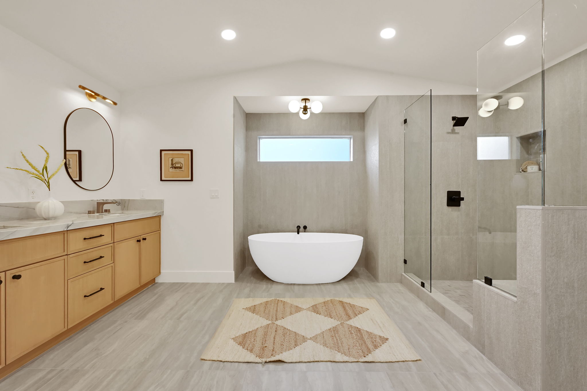 Primary bathroom with vaulted ceilings