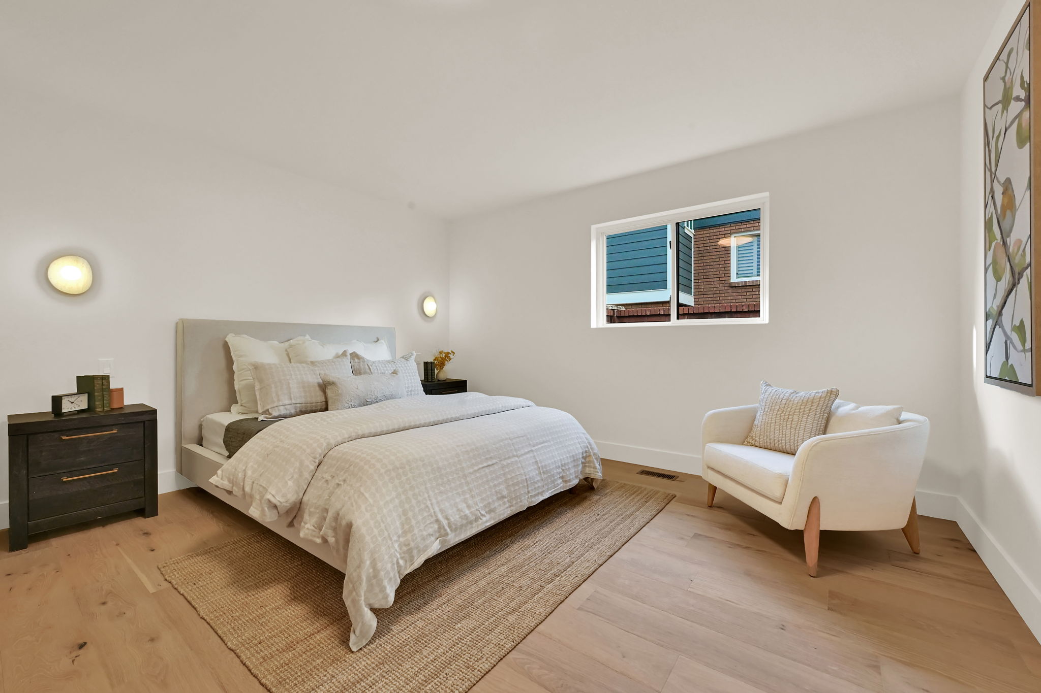Primary bedroom with sconce lighting