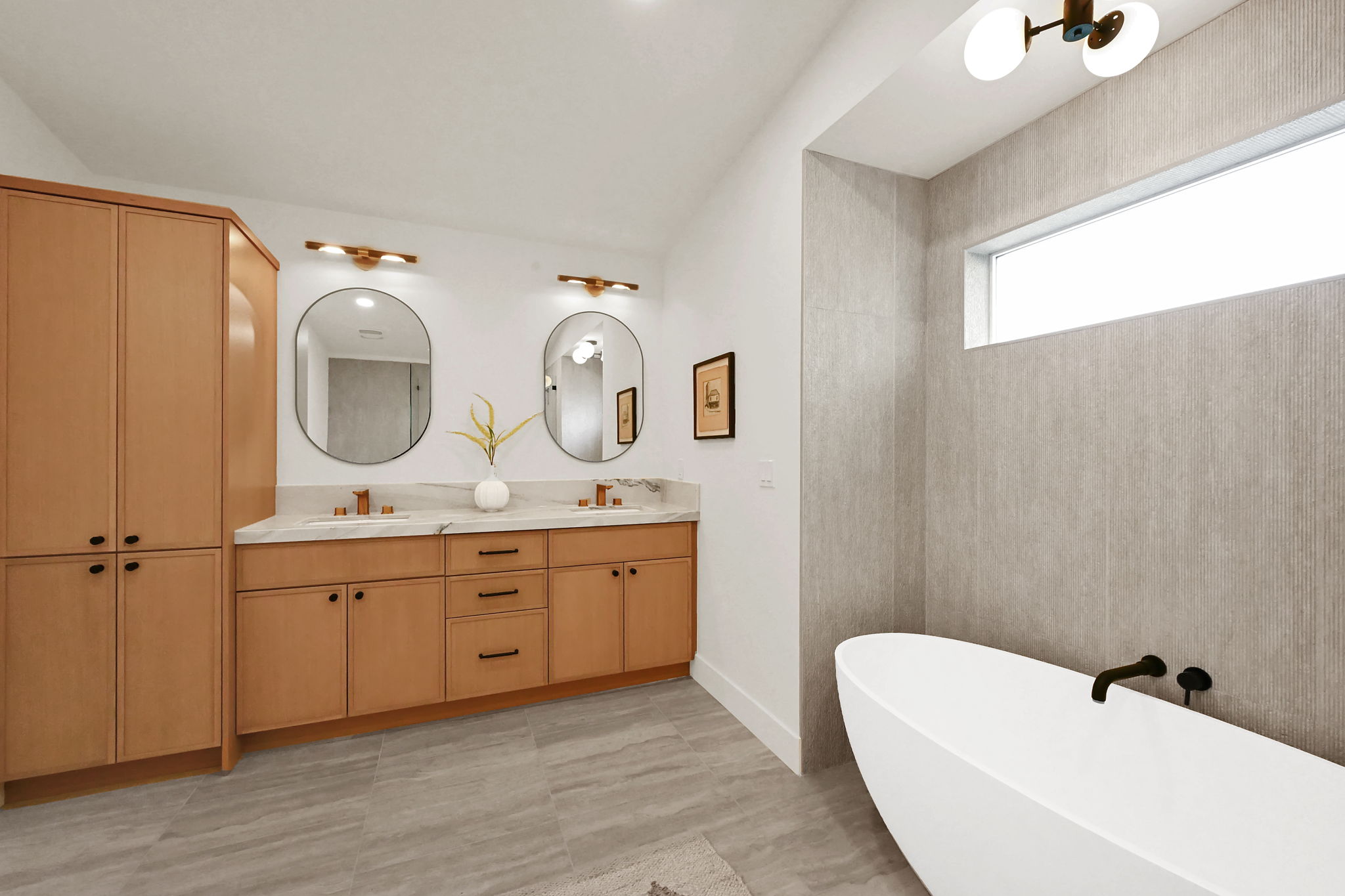 Primary bathroom featuring double sinks