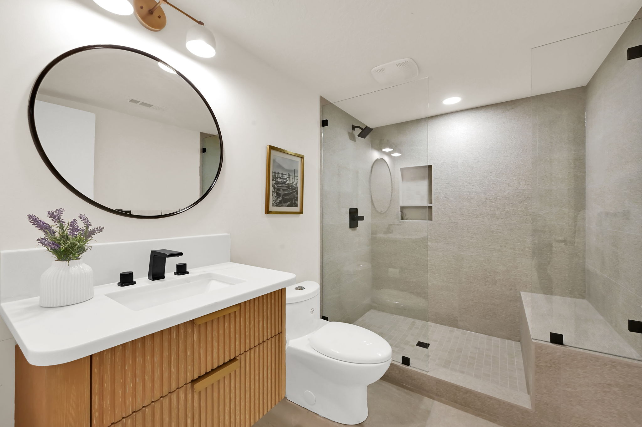 Basement bathroom with walk-in shower and with a bench