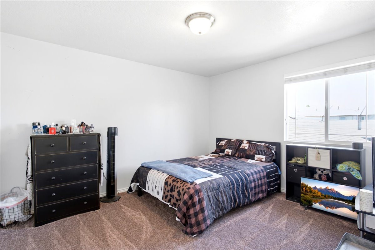 Room with neutral painted walls and a beige carpeted floor