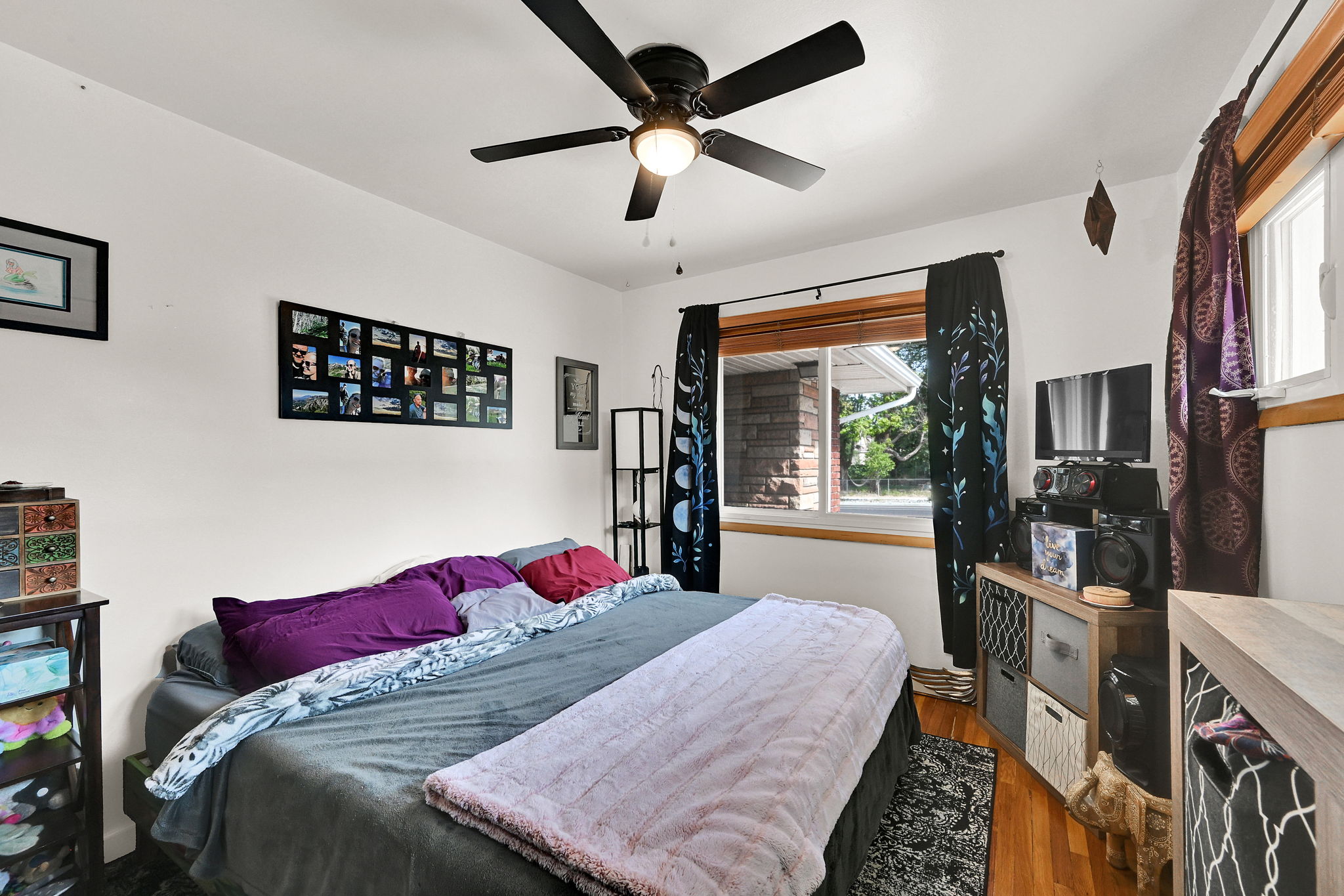 Hardwood flooring complemented by a ceiling fan with integrated lighting