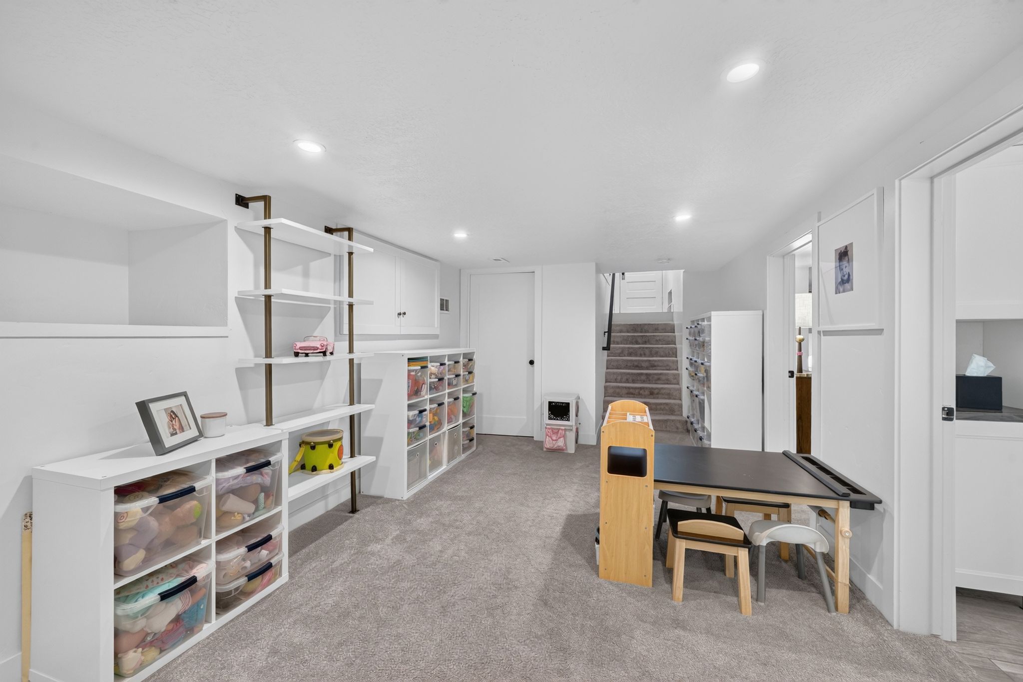 Spacious bonus room featuring recessed lighting, light gray carpeting, and ample built-in storage