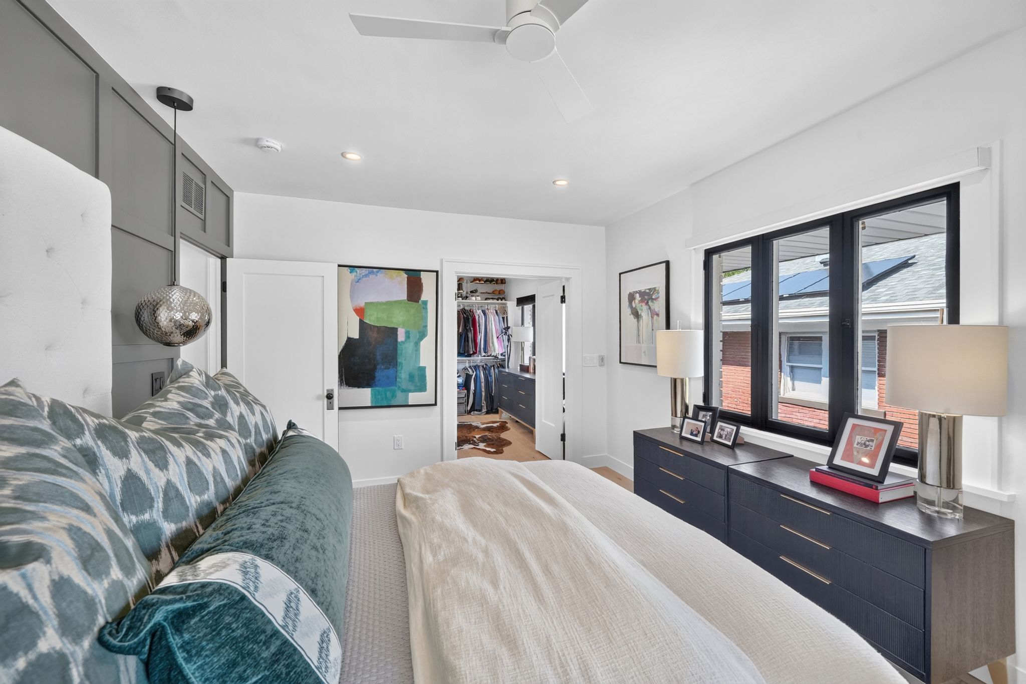 Bedroom featuring a dark-framed window, recessed lighting, and a ceiling fan
